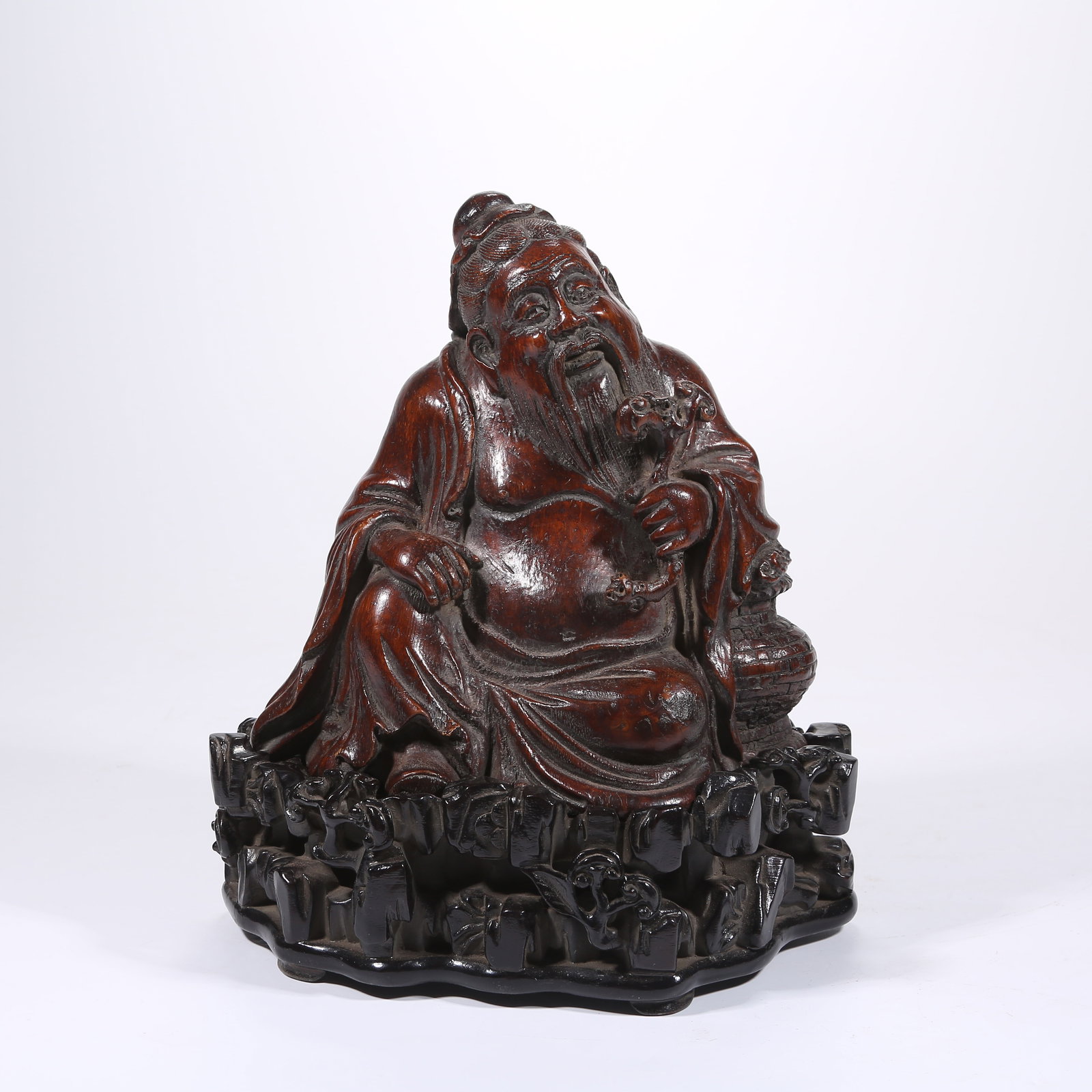 A BAMBOO ROOT CARVING OF AN ELDER GATHERING HERBS (1 of 9)