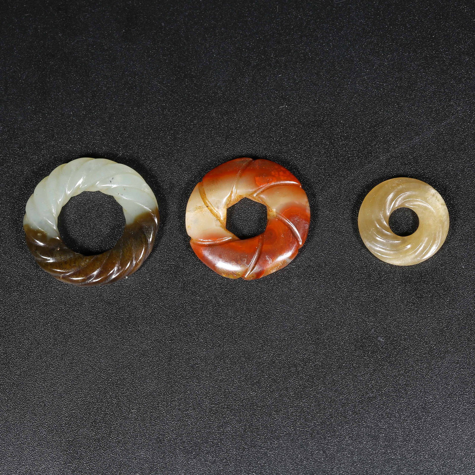 A SET OF ANCIENT JADE TWISTED-WIRE RINGS: Set of Ancient Jade Twisted-Wire Rings