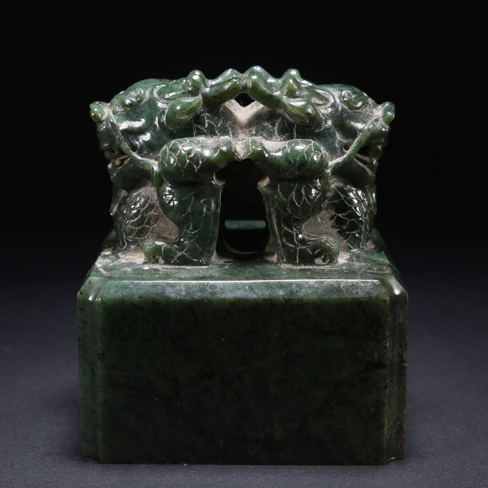 A HETIAN JASPER LARGE SEAL WITH DOUBLE DRAGON KNOBS, INSCRIBED WITH POETIC SCRIPT (1 of 9)