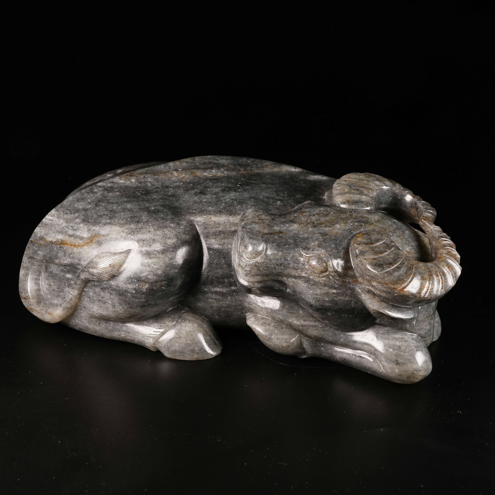 A HETIAN JADE RECUMBENT OX ORNAMENT (1 of 7)