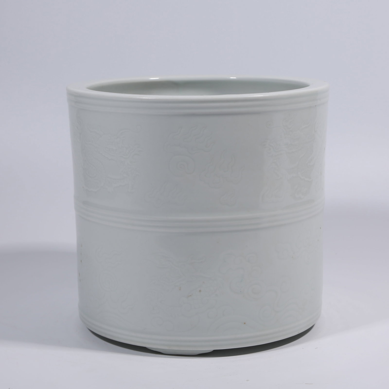 A WHITE-GLAZE BRUSH POT WITH INCISED DRAGON PATTERN (1 of 9)