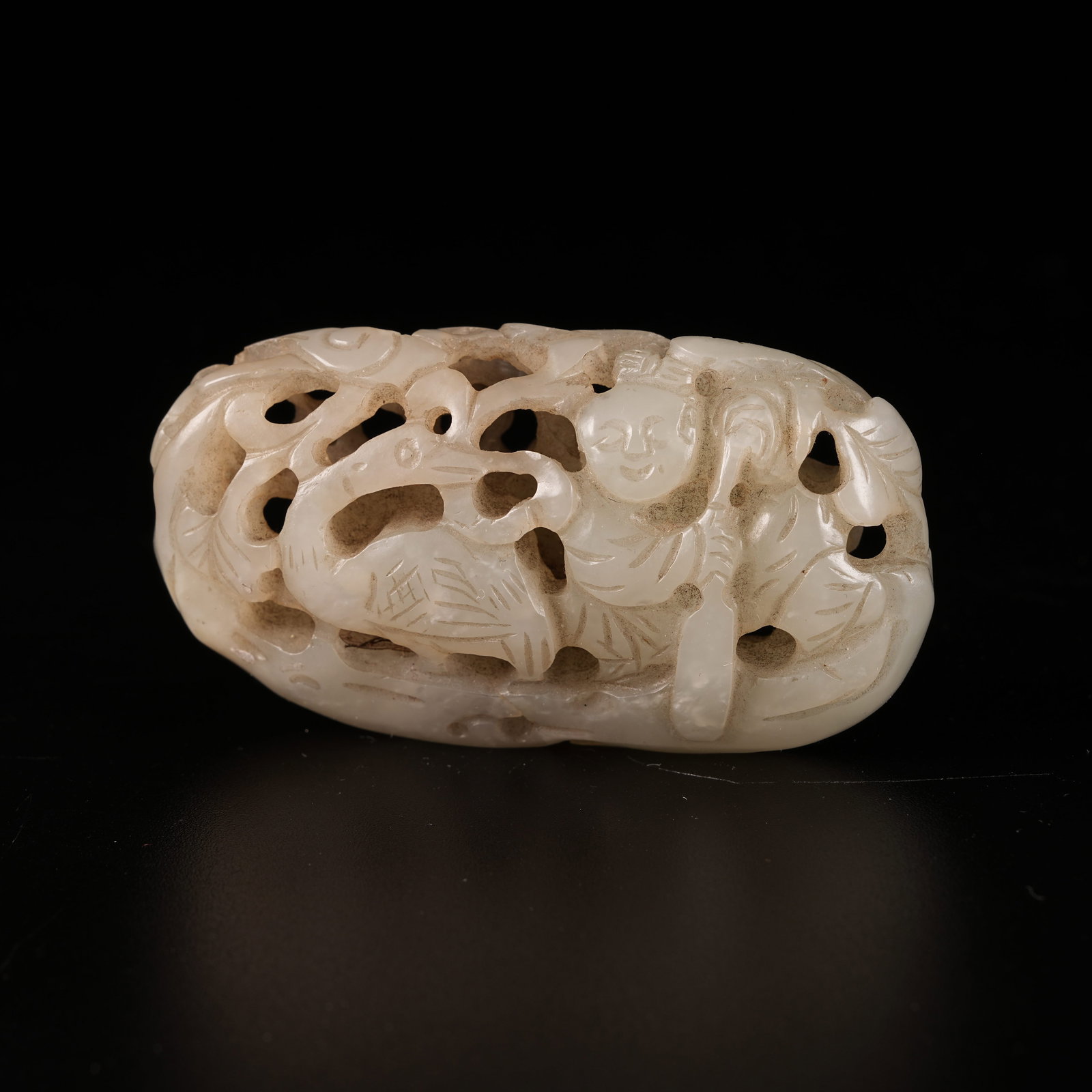 A HETIAN JADE PLAYING-CRANE BOY ORNAMENT (1 of 8)