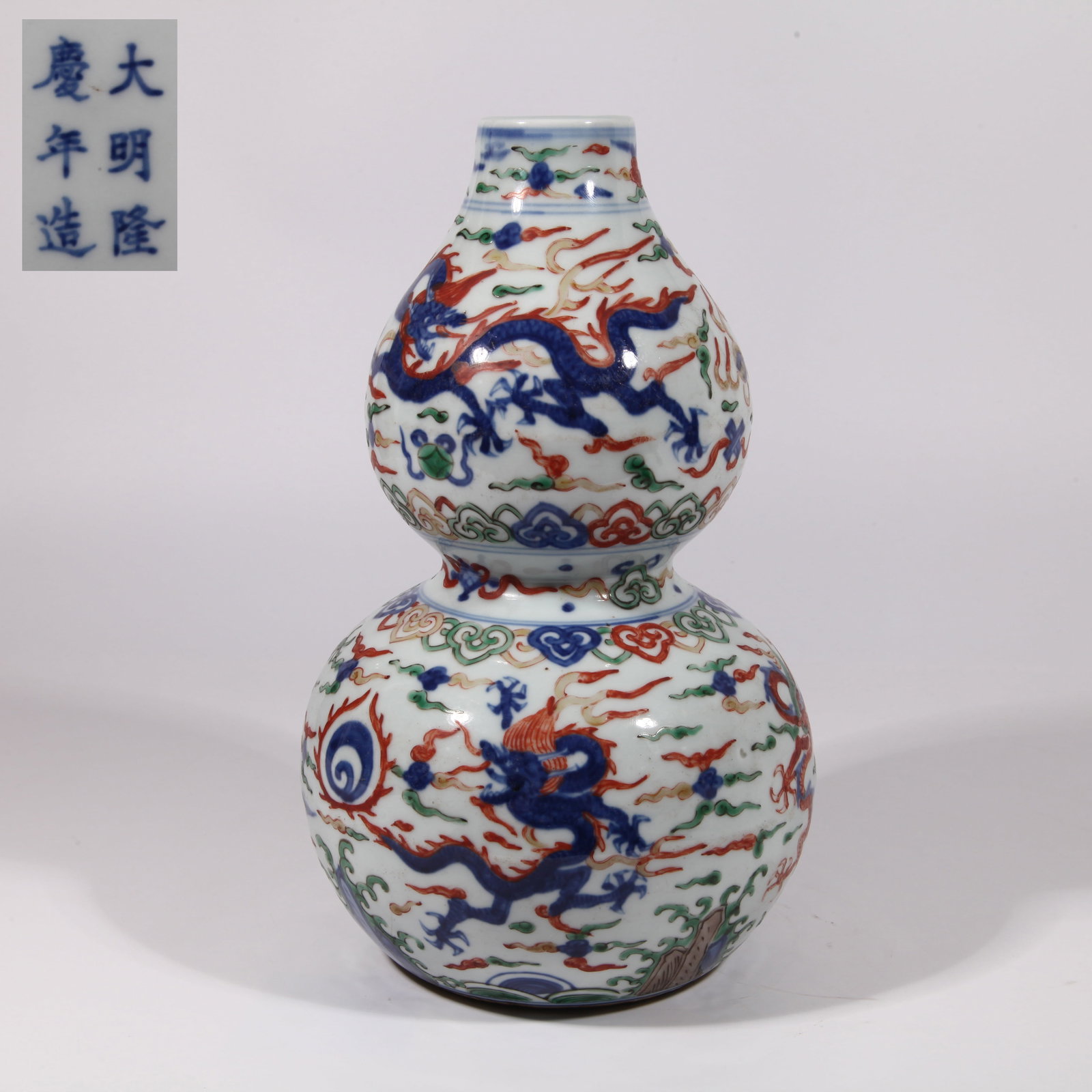 A GOURD VASE WITH RIVER CLIFF AND SEA DRAGON PATTERN IN WUCAI (1 of 9)