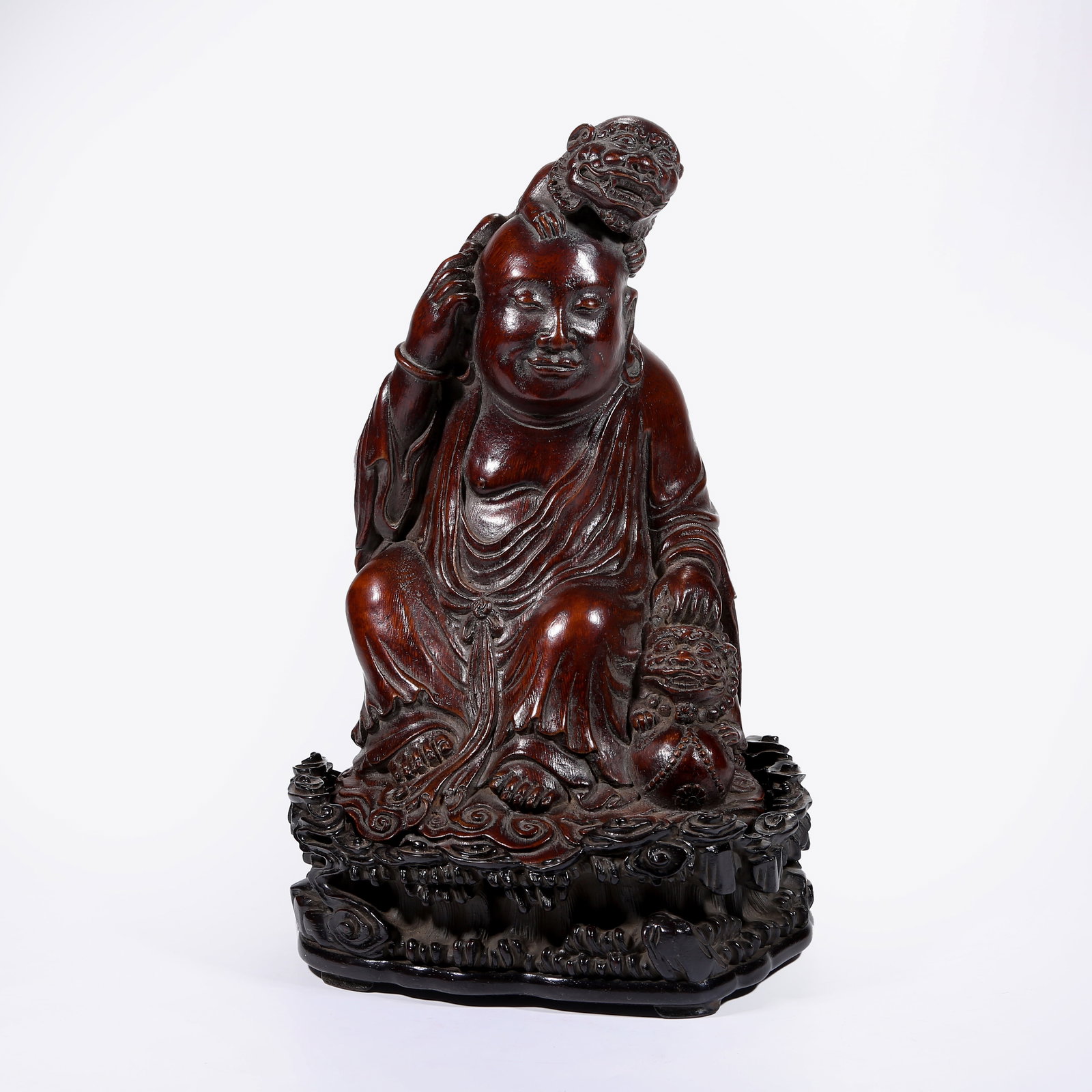 A BAMBOO ROOT CARVING OF ARHAT PLAYING WITH LION (1 of 9)