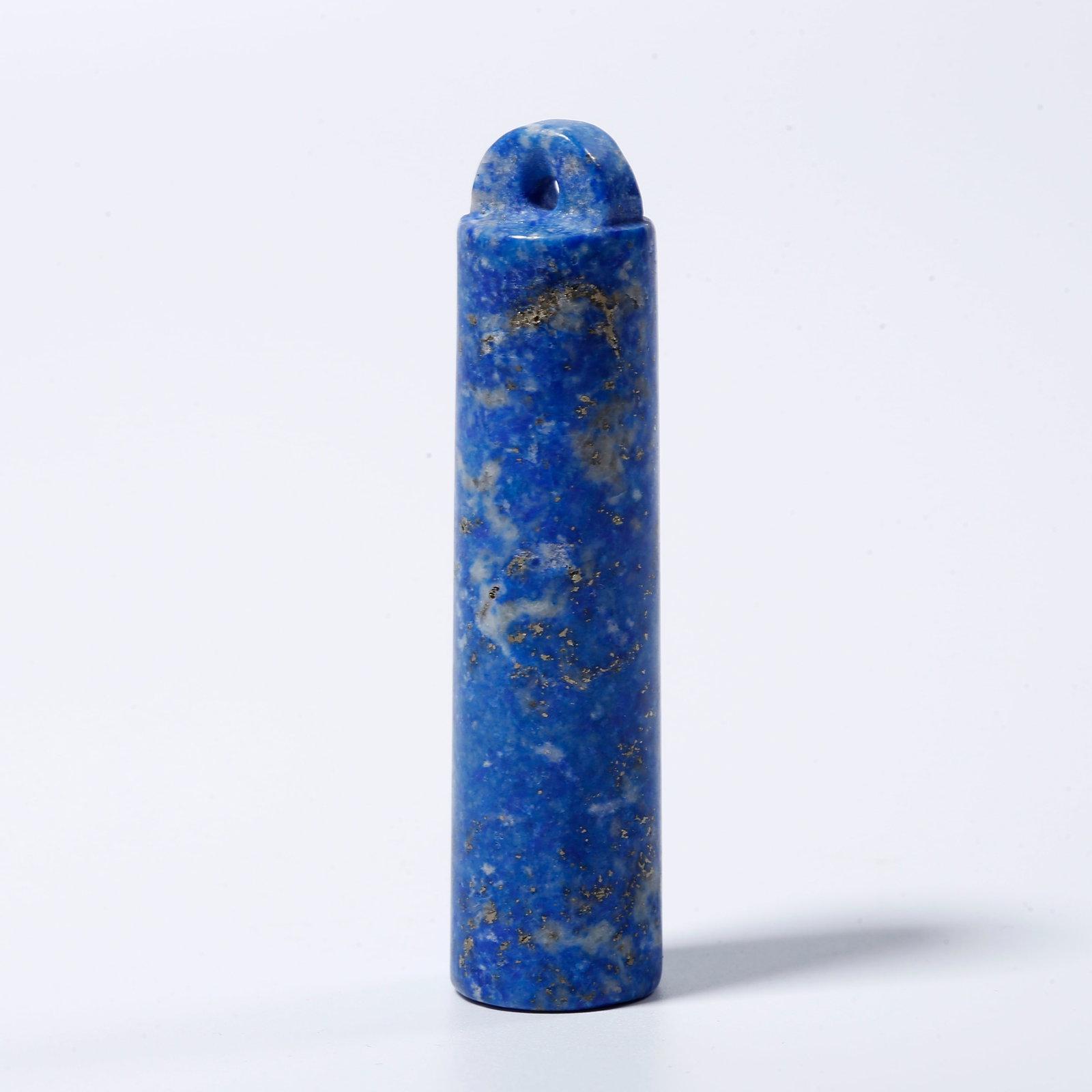 A LAPIS LAZULI FEATHER TUBE: Lapis lazuli feather tube