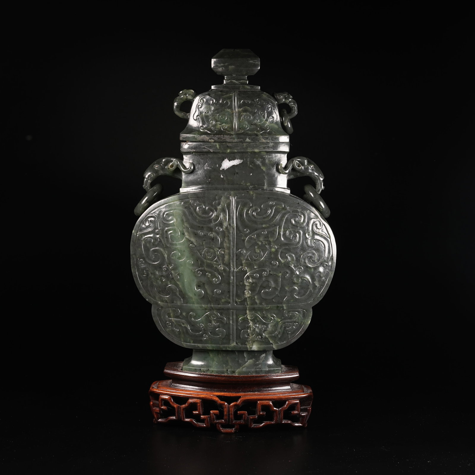 A HETIAN GREEN JADE BEAST-FACE PATTERN COVERED VASE WITH HANDLES: Hetian Green Jade Beast-Face Pattern Covered Vase with Handles