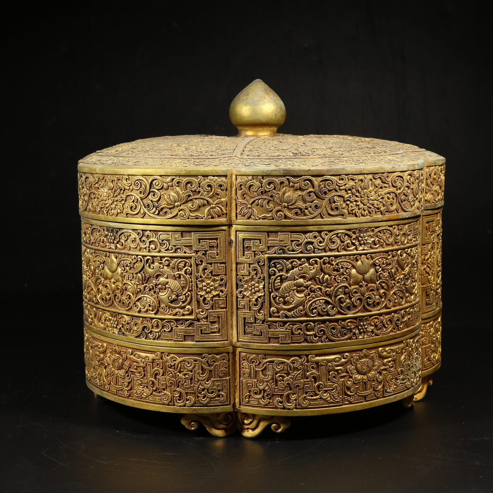 A GILT-BRONZE MULTI-TIERED COVERED BOX WITH "FORTUNE AND LONGEVITY" DESIGN: Gilt-Bronze Multi-Tiered Covered Box with "Fortune and Longevity" Design
