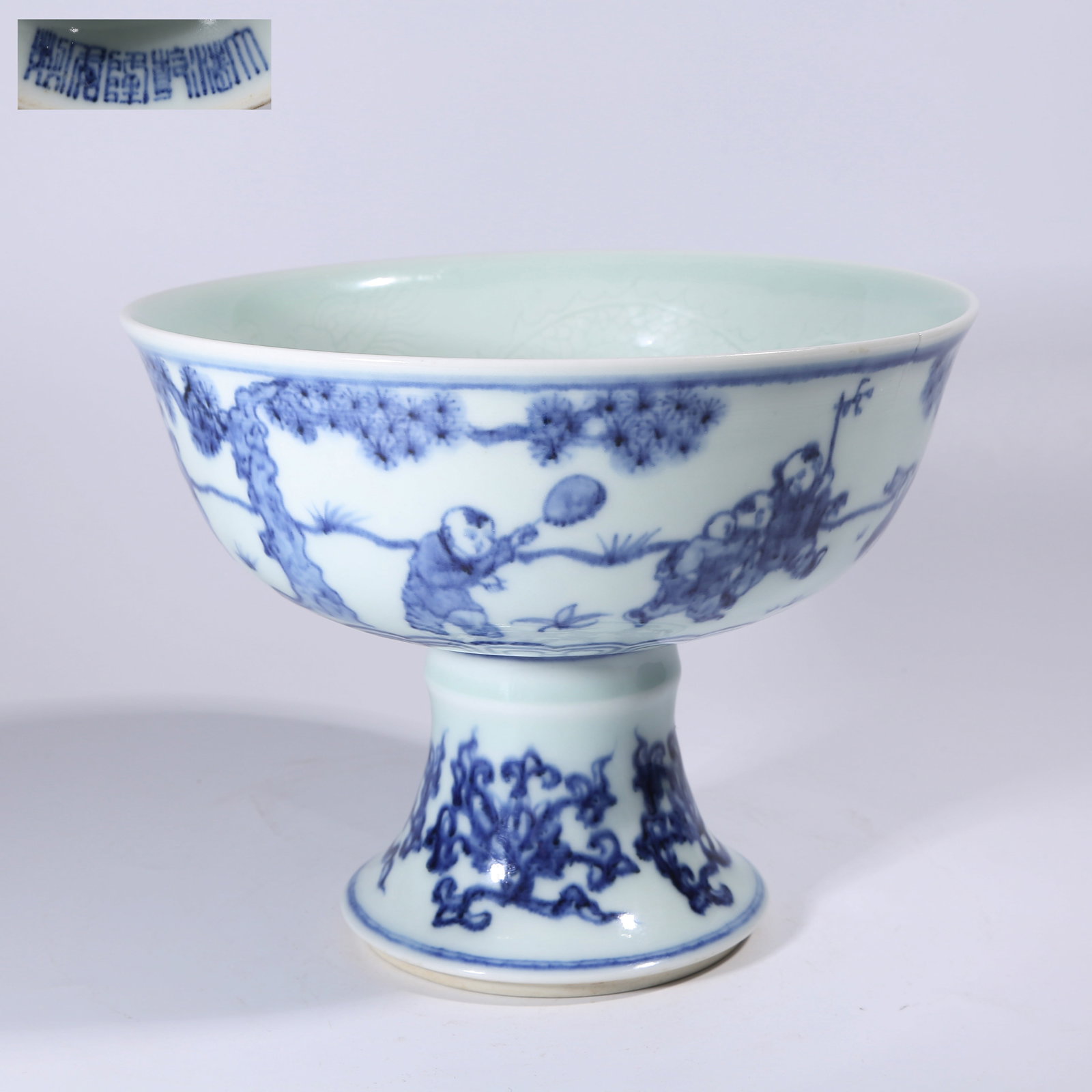 A BLUE-AND-WHITE HIGH-FOOT BOWL WITH CHILDREN AT PLAY PATTERN: Blue-and-White High-Foot Bowl with Children at Play Pattern