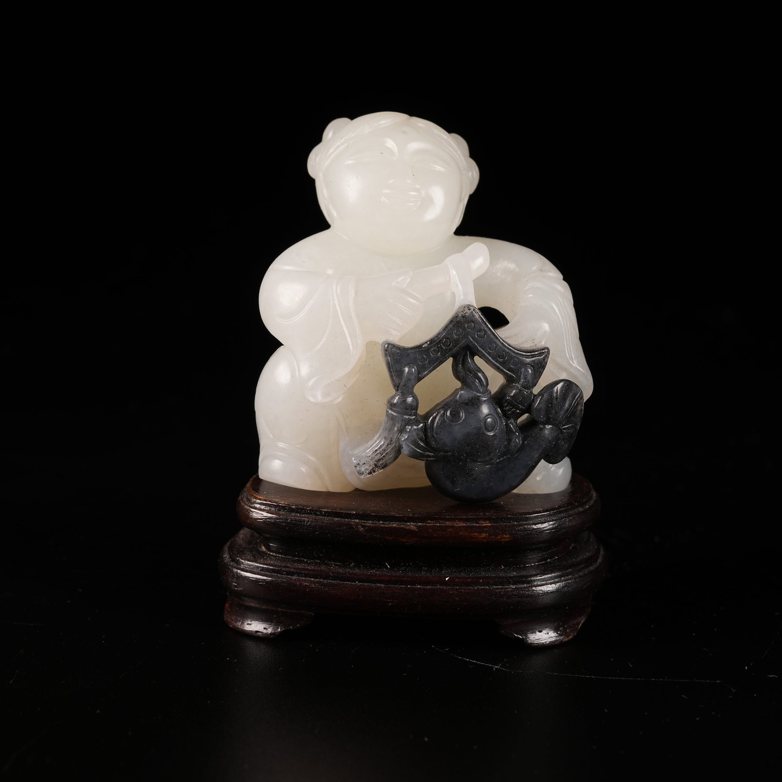 A HETIAN JADE SKILLFULLY CARVED PLAYING-FISH BOY ORNAMENT (1 of 8)