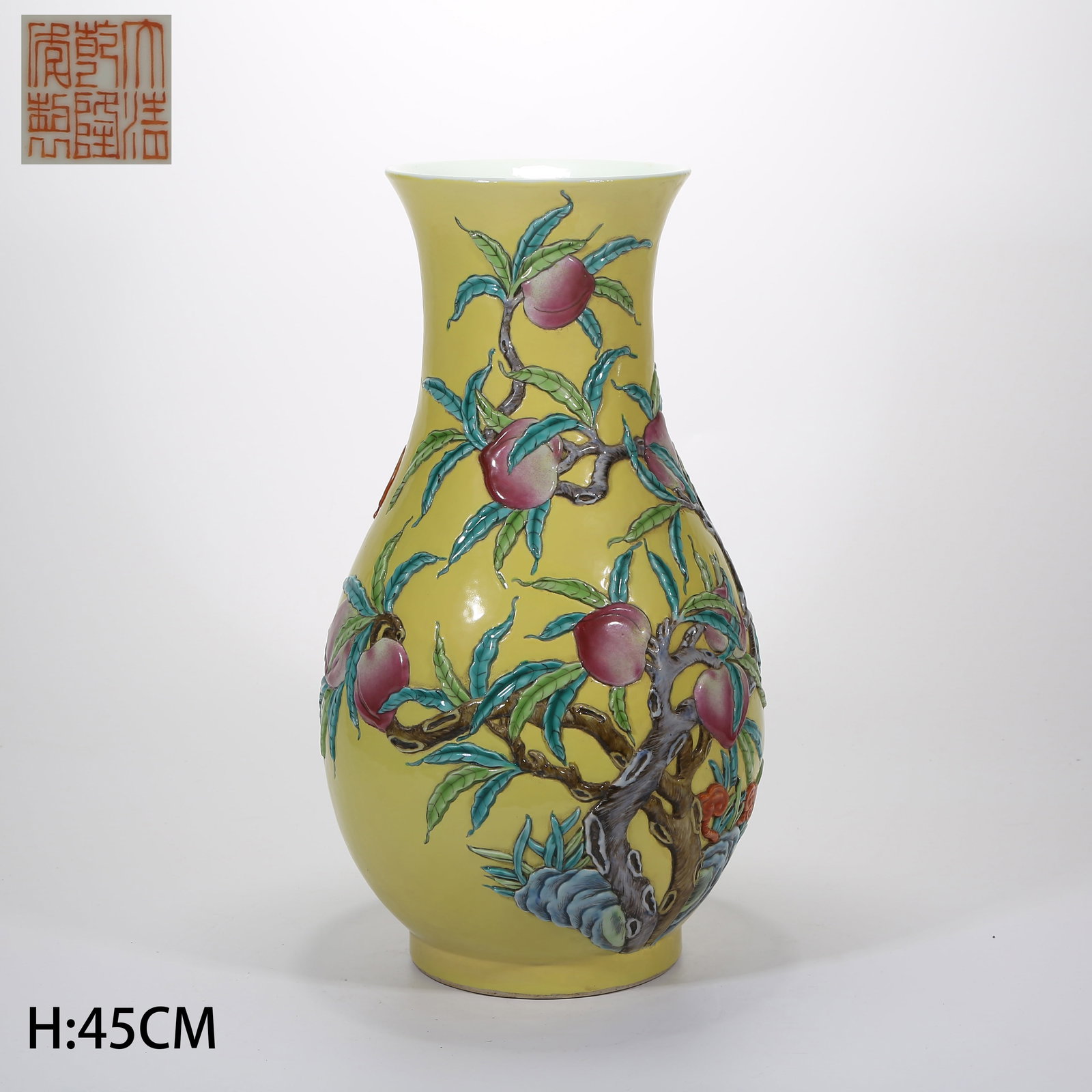 A FAMILLE ROSE CARVED PORCELAIN OPEN-MOUTHED VASE WITH LONGEVITY AND BLESSINGS MOTIF: Famille Rose Carved Porcelain Open-Mouthed Vase with Longevity and Blessings Motif
