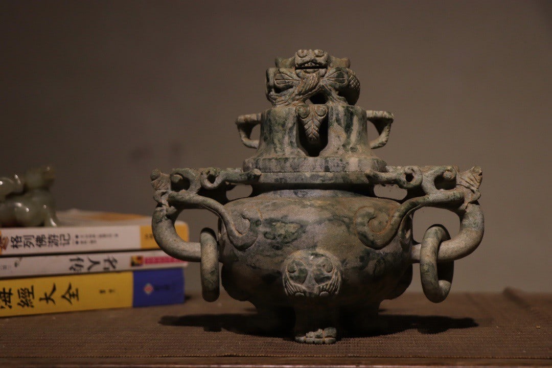 A THREE-LEGGED DRAGON-HEAD CELADON JADE INCENSE BURNER (1 of 9)