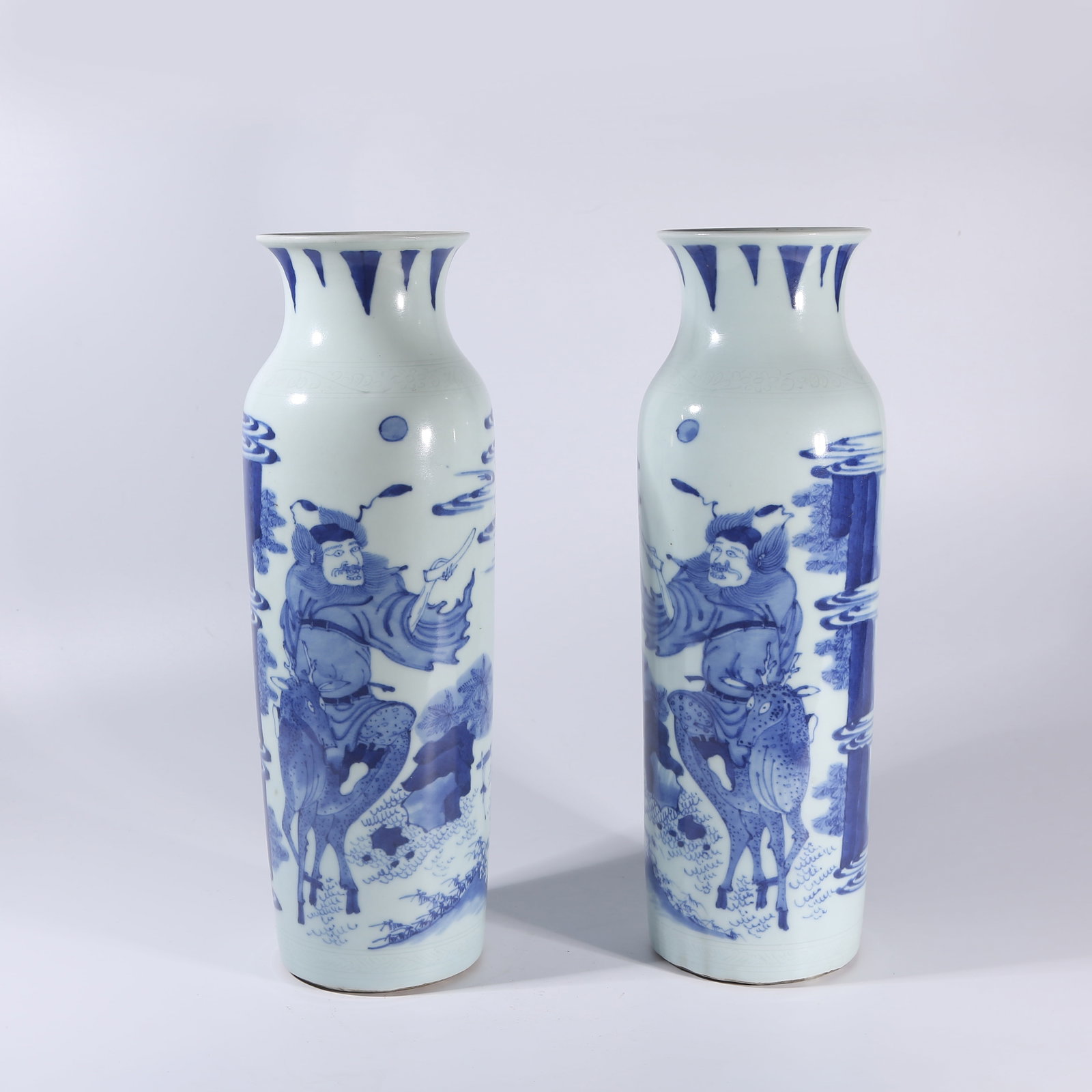 A SET OF BLUE-AND-WHITE PESTLE-SHAPED VASES WITH ZHONG KUI MOTIF (1 of 10)