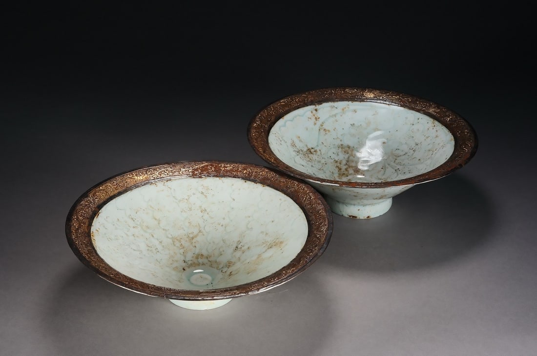 A PAIR OF HUTIAN KILN CARVED-FLORAL CUPS: Pair of Hutian kiln carved-floral cups