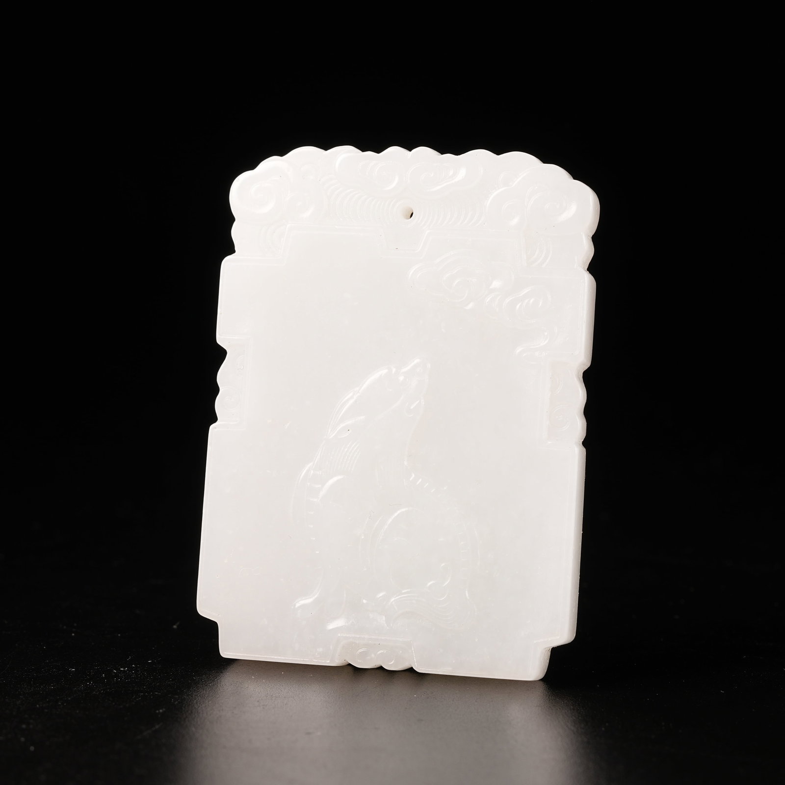 A HETIAN JADE AUSPICIOUS BEAST PATTERN PLAQUE (1 of 9)