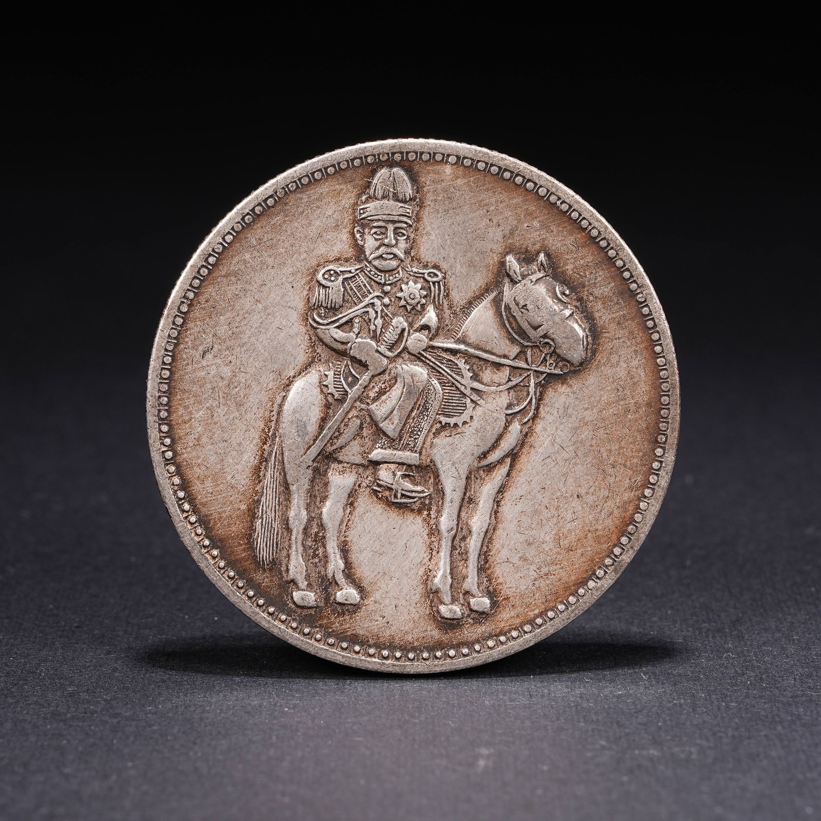 A SILVER DOLLAR COIN: One Silver dollar Coin
