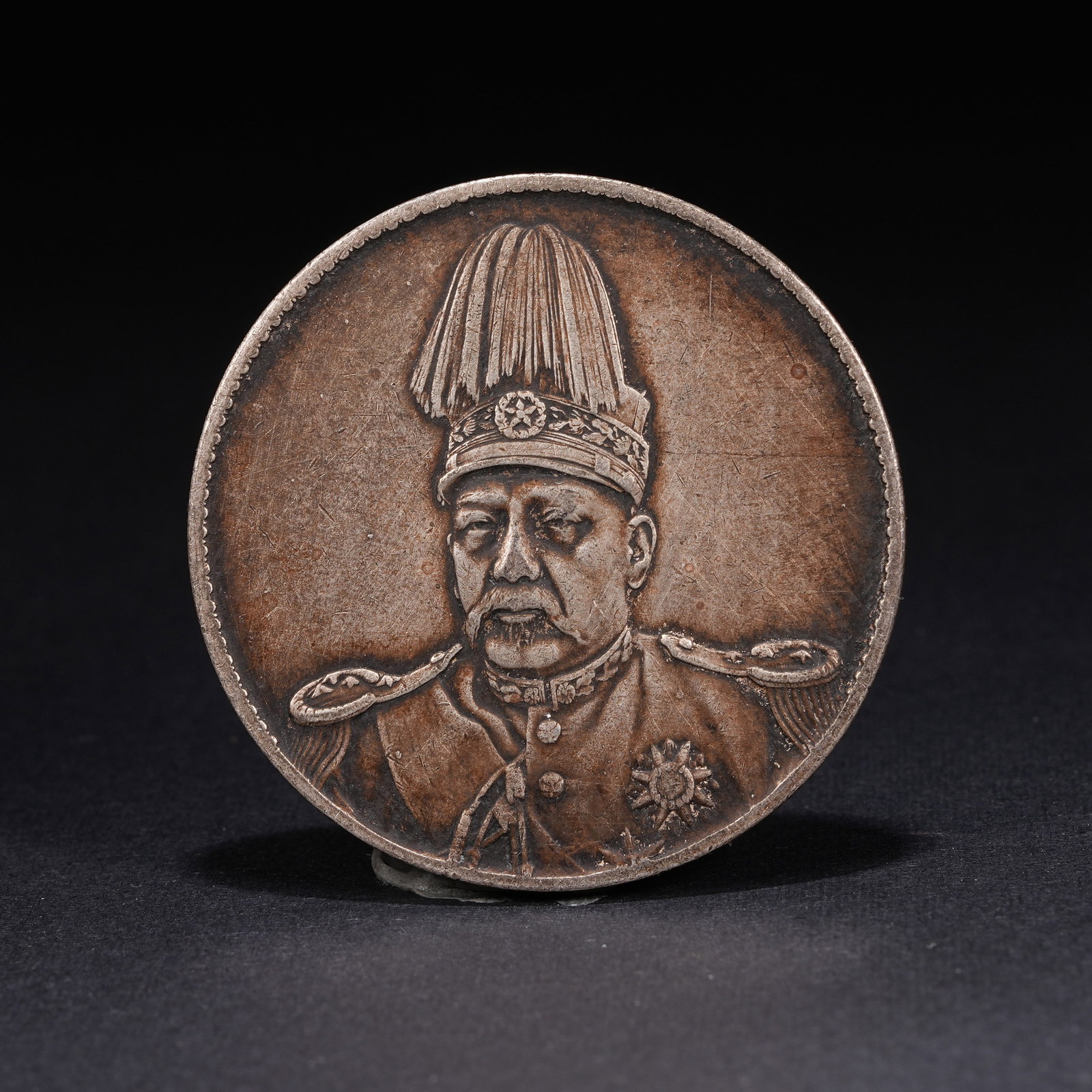 A SILVER DOLLAR COIN: One Silver dollar Coin