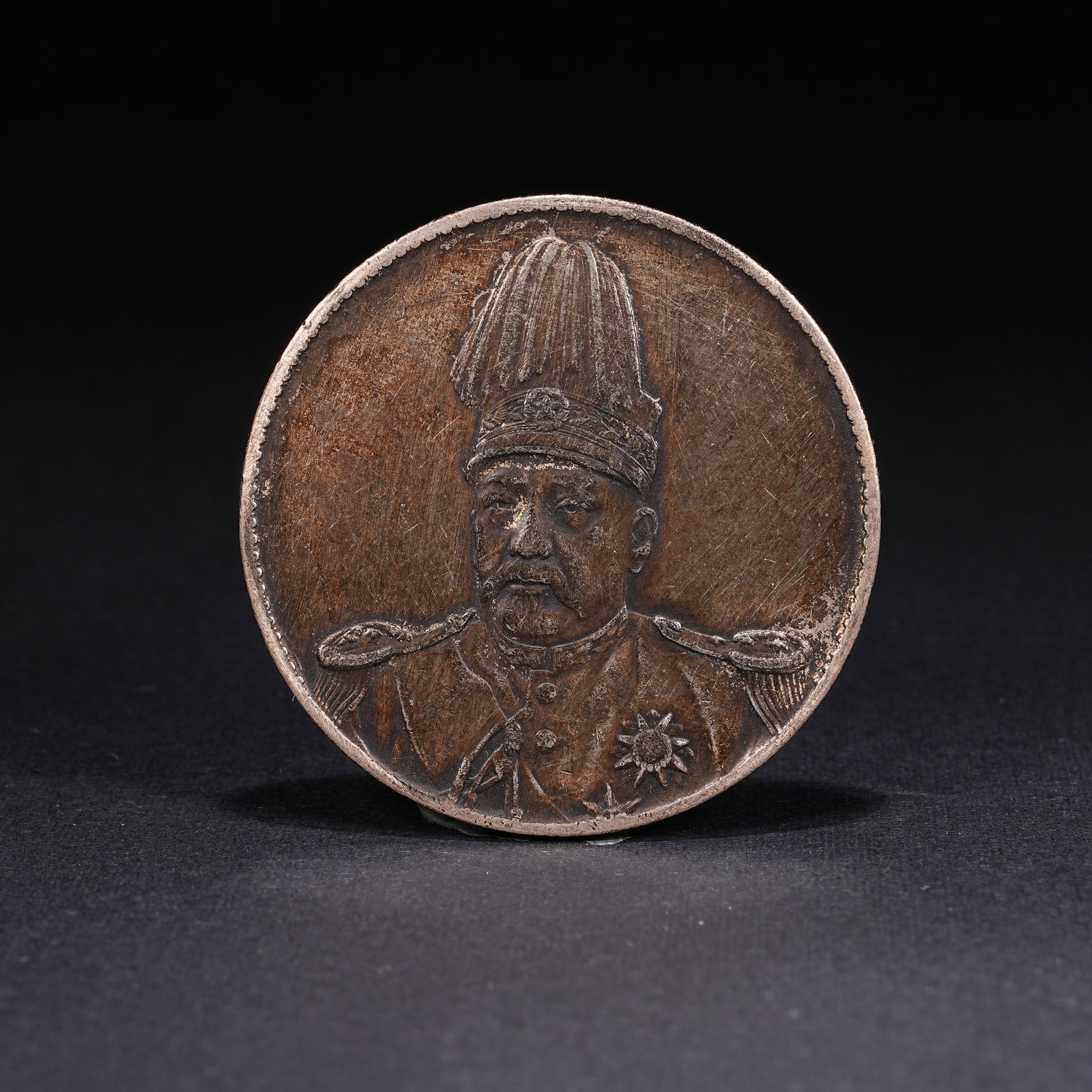 A SILVER DOLLAR COIN: One Silver dollar Coin