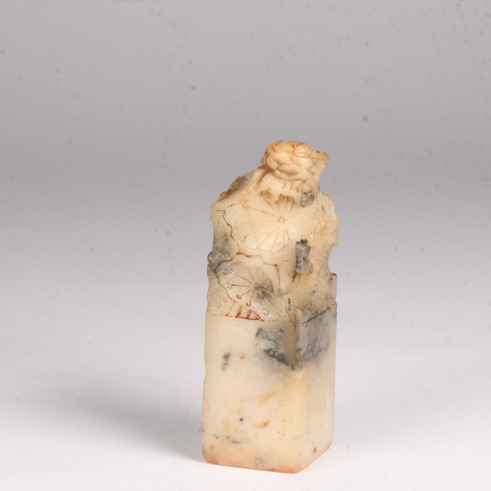 A SHOUSHAN STONE SEAL WITH LOTUS-SHAPED KNOB: Shoushan Stone Seal with Lotus-Shaped Knob