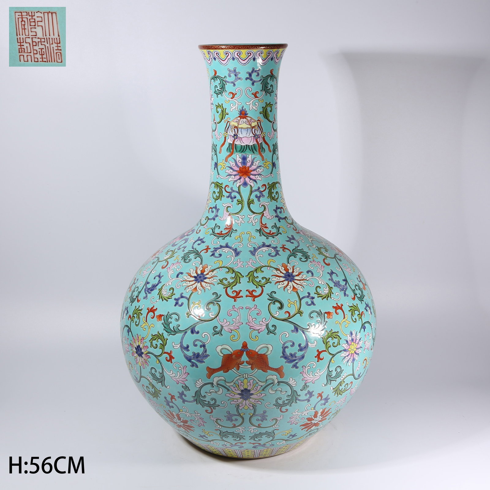 A TURQUOISE-GROUND FAMILLE ROSE PASSIONFLOWER WITH EIGHT AUSPICIOUS SYMBOLS TIANQIU VASE: Turquoise-Ground Famille Rose Passionflower with Eight Auspicious Symbols Tianqiu Vase