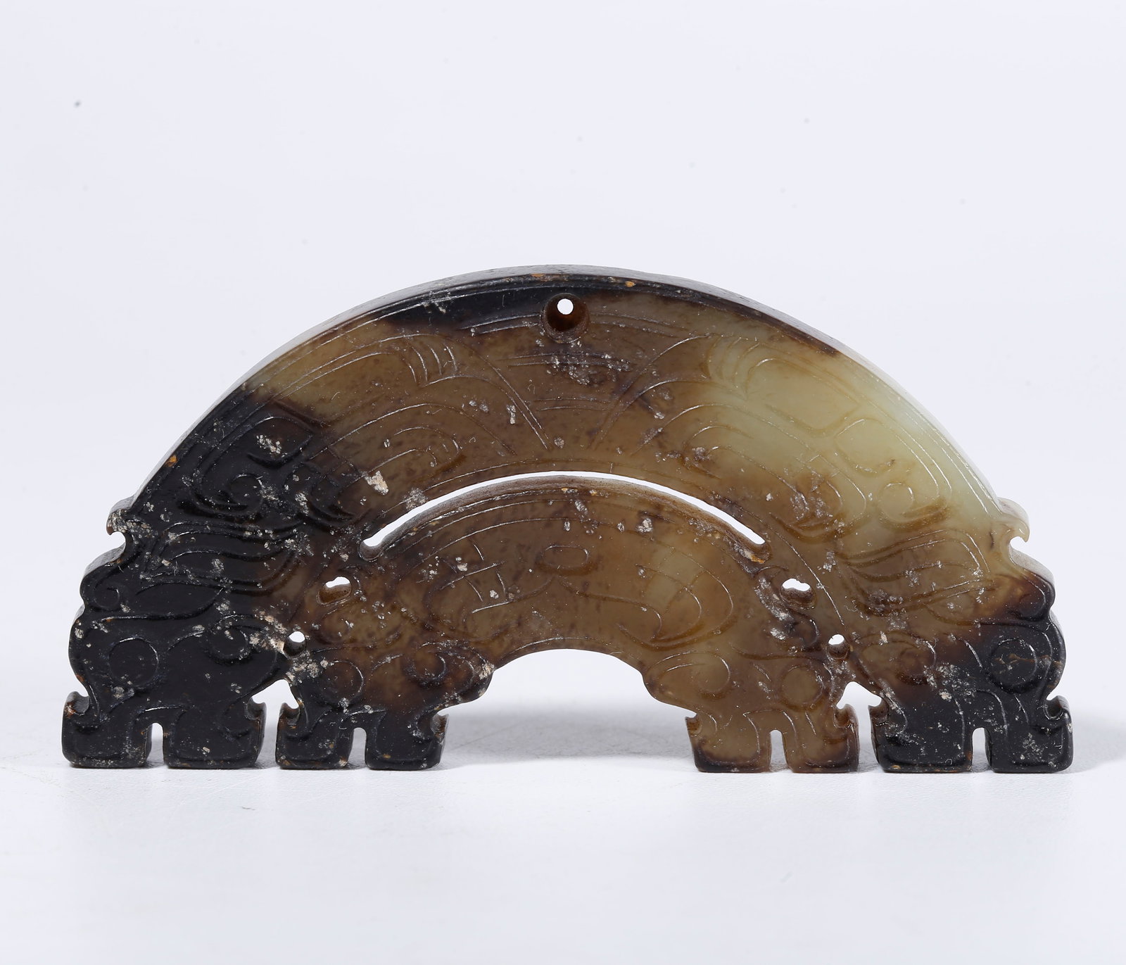 A HETIAN JADE CARVED DOUBLE HUANG PENDANT: Hetian jade carved double huang pendant
