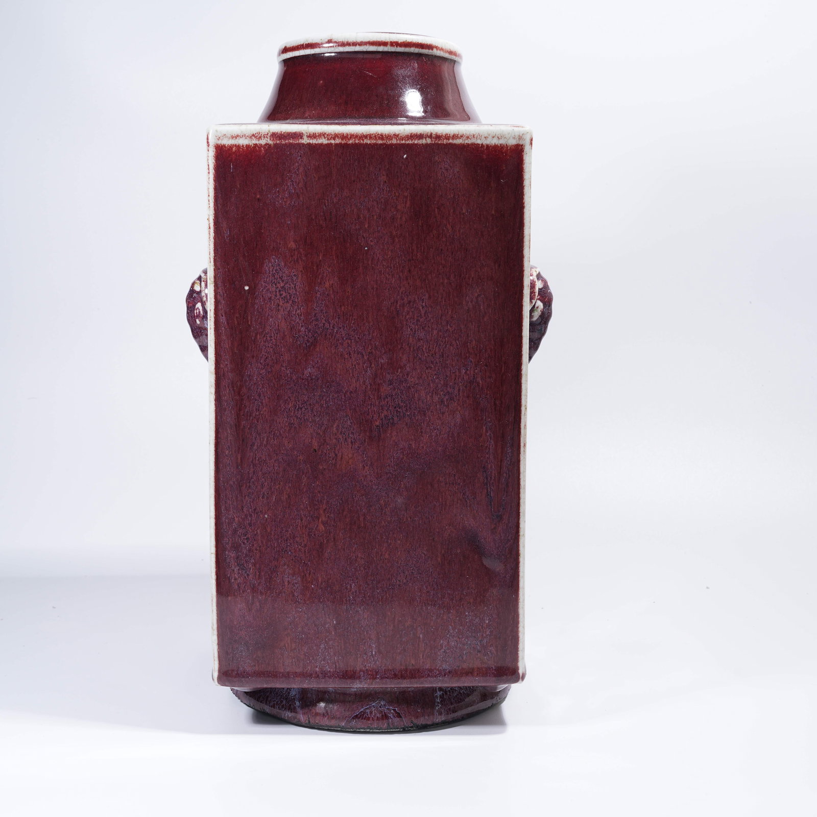 A FLAMBE GLAZE CONG-STYLE VASE WITH ELEPHANT EARS: Flambe Glaze Cong-Style Vase with Elephant Ears