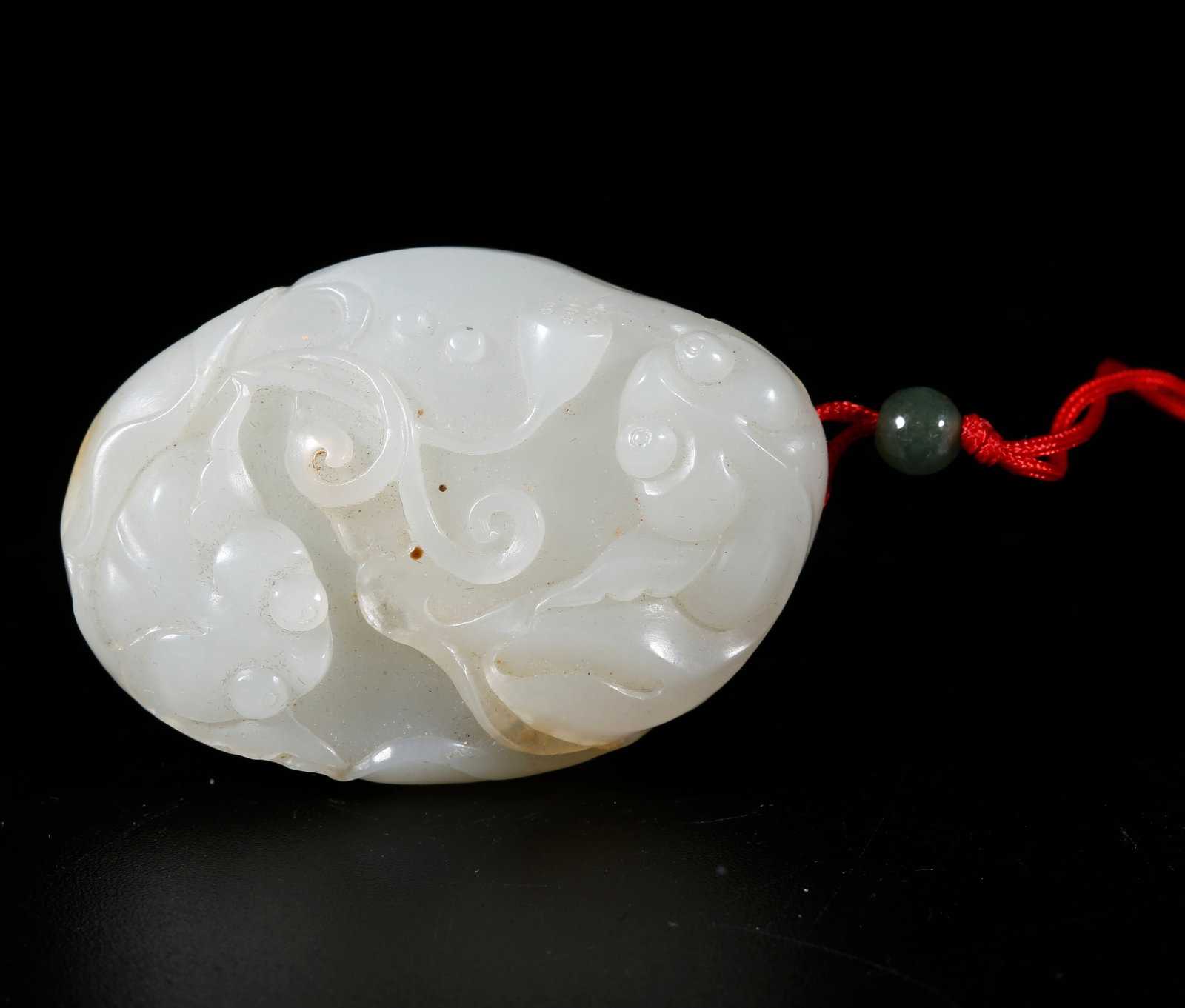 A HETIAN JADE CARVED PENDANT (1 of 10)