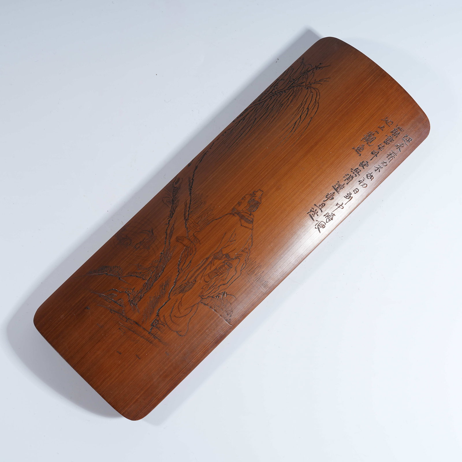 A BAMBOO CARVED ARM REST WITH ELEGANT GATHERING UNDER PINE DESIGN: Bamboo Carved Arm Rest with Elegant Gathering Under Pine Design