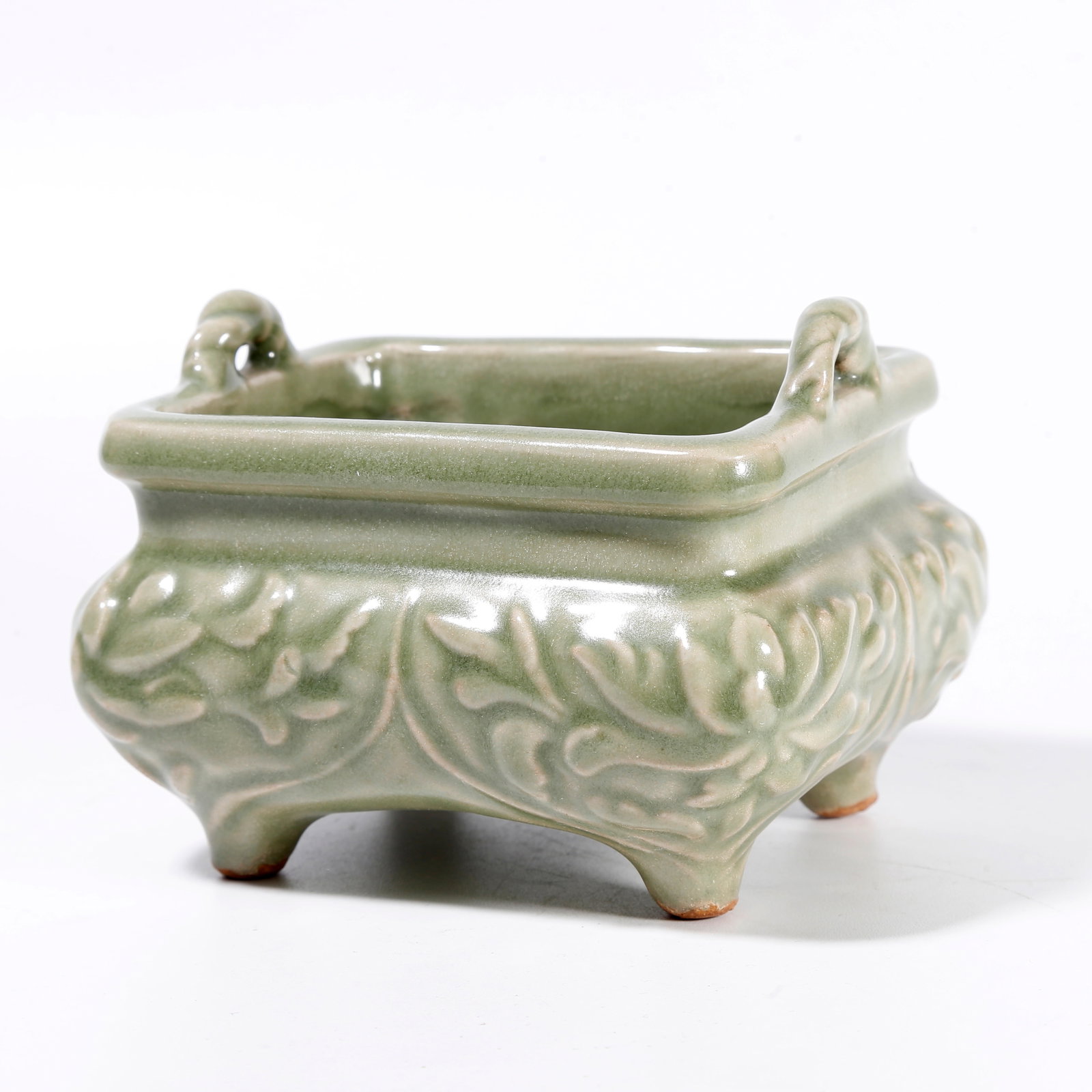 A FOUR-LEGGED INCENSE BURNER WITH FLORAL MOTIFS FROM YAOZHOU KILN: Four-Legged Incense Burner with Floral Motifs from Yaozhou Kiln