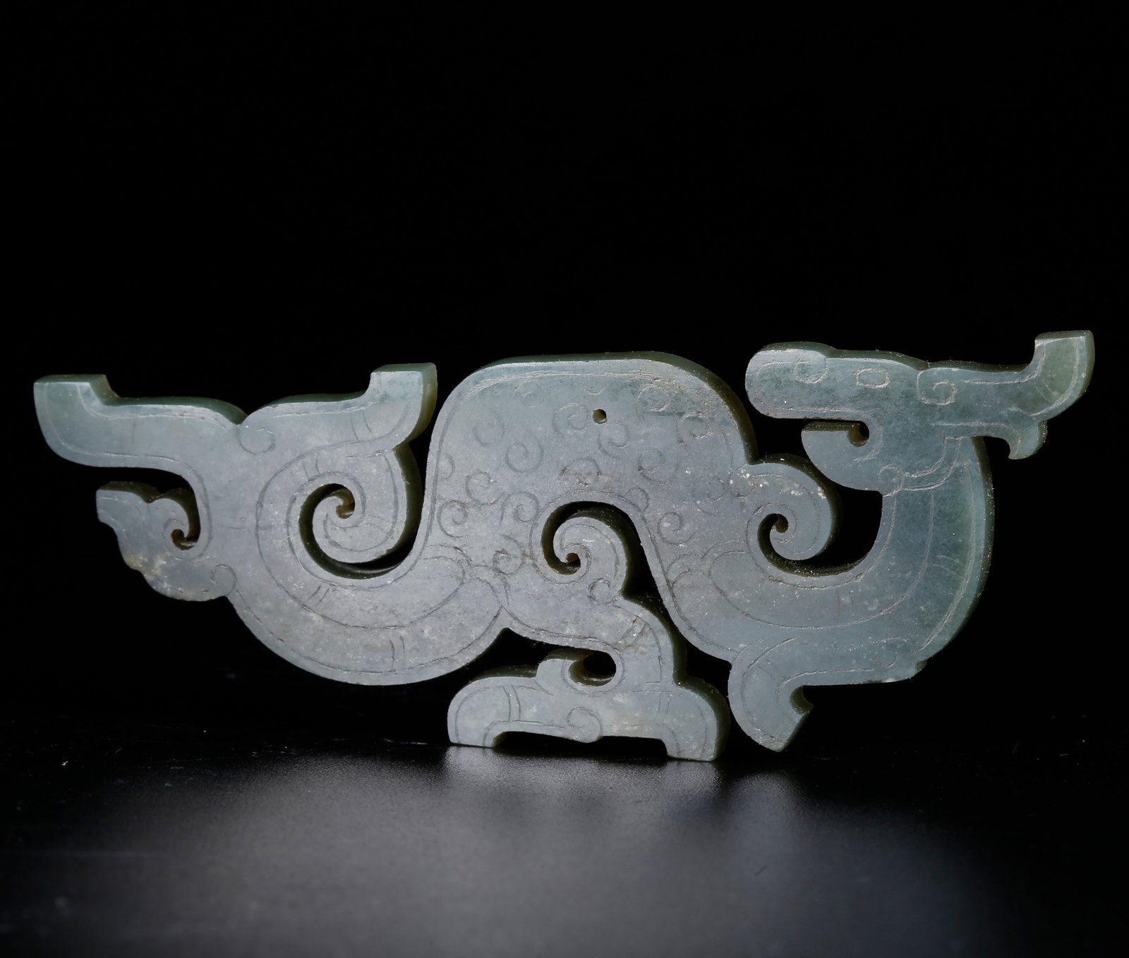 A HETIAN JASPER PENDANT CARVED WITH DRAGON PATTERN (1 of 10)