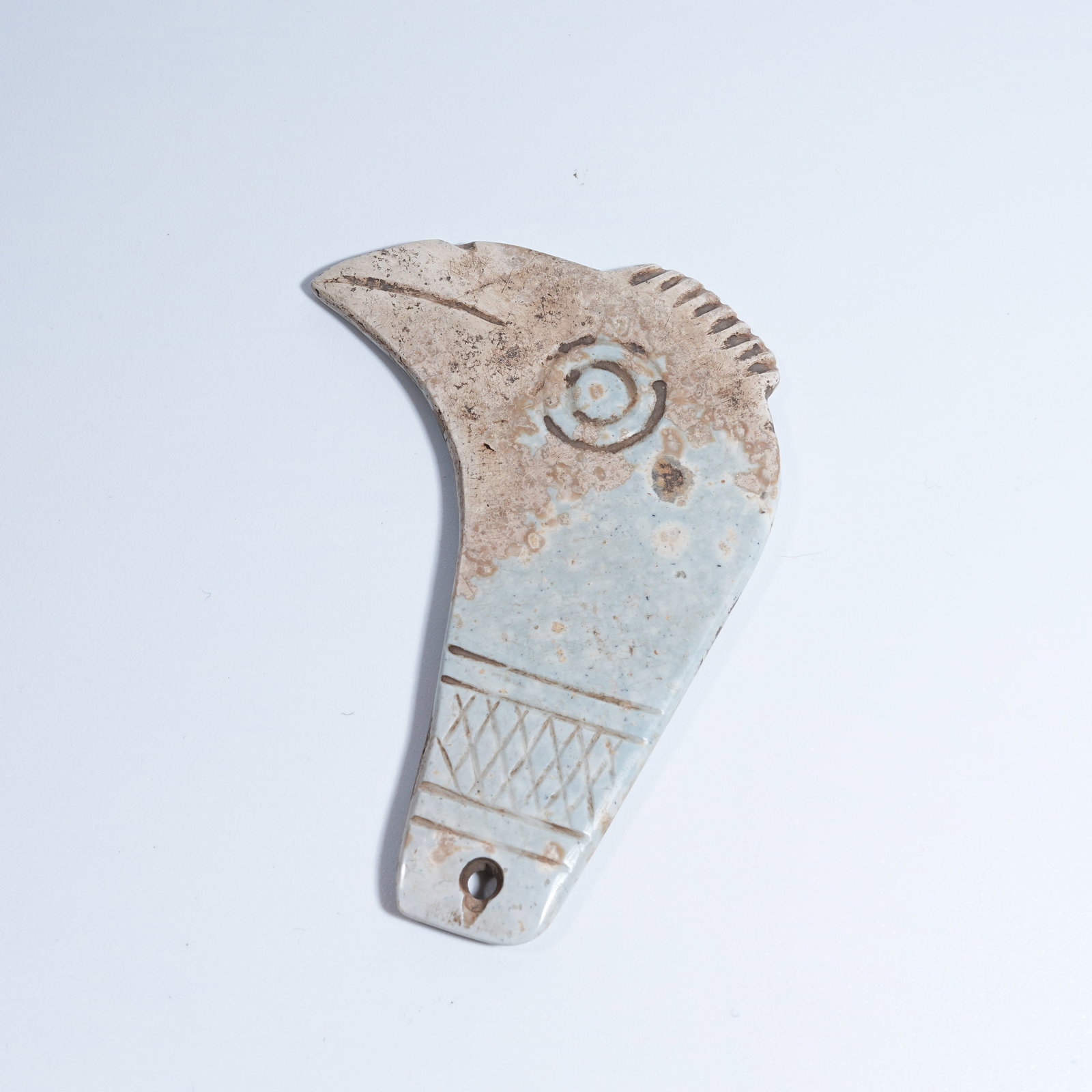 A HONGSHAN CULTURE ARCHAIC JADE PHOENIX-HEAD PENDANT: Hongshan Culture archaic jade phoenix-head pendant