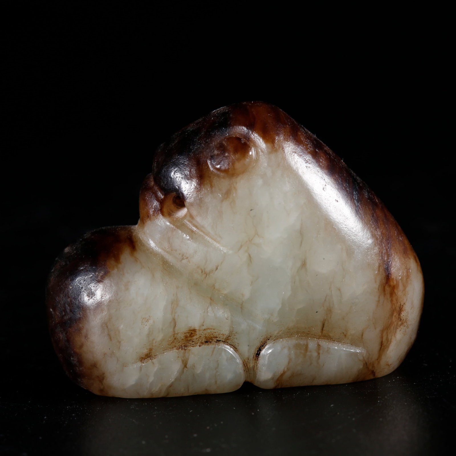 A HETIAN JADE CARVED BEAST-SHAPED ORNAMENT (1 of 9)