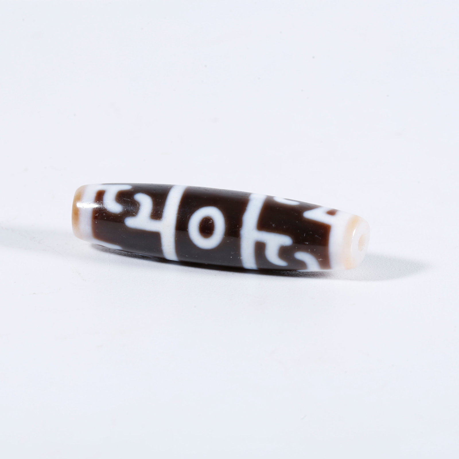 A THREE-EYE DZI BEAD: Three-Eye Dzi Bead