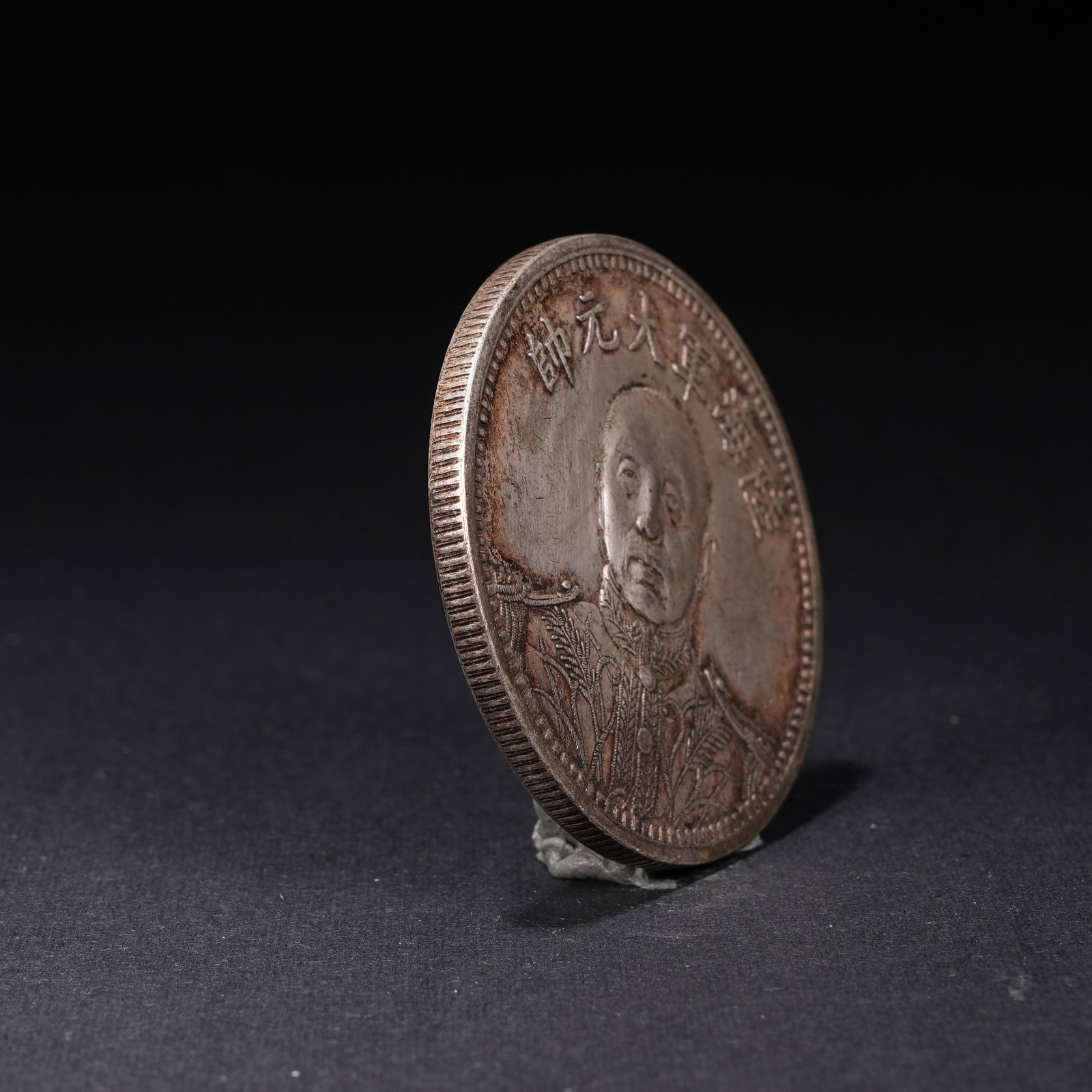 A SILVER DOLLAR COIN - 2