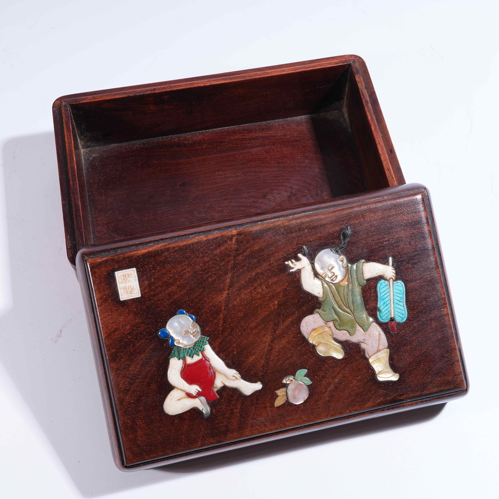 A HUANGHUALI COVERED BOX INLAID WITH "HUNDRED TREASURES" DEPICTING CHILDREN AT PLAY: Huanghuali Covered Box Inlaid with "Hundred Treasures" Depicting Children at Play