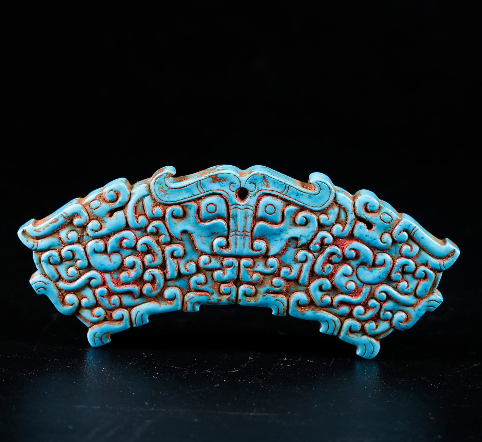 A TURQUOISE CARVED HUANG WITH BEAST MASK PATTERN: Turquoise Carved Huang with Beast Mask Pattern