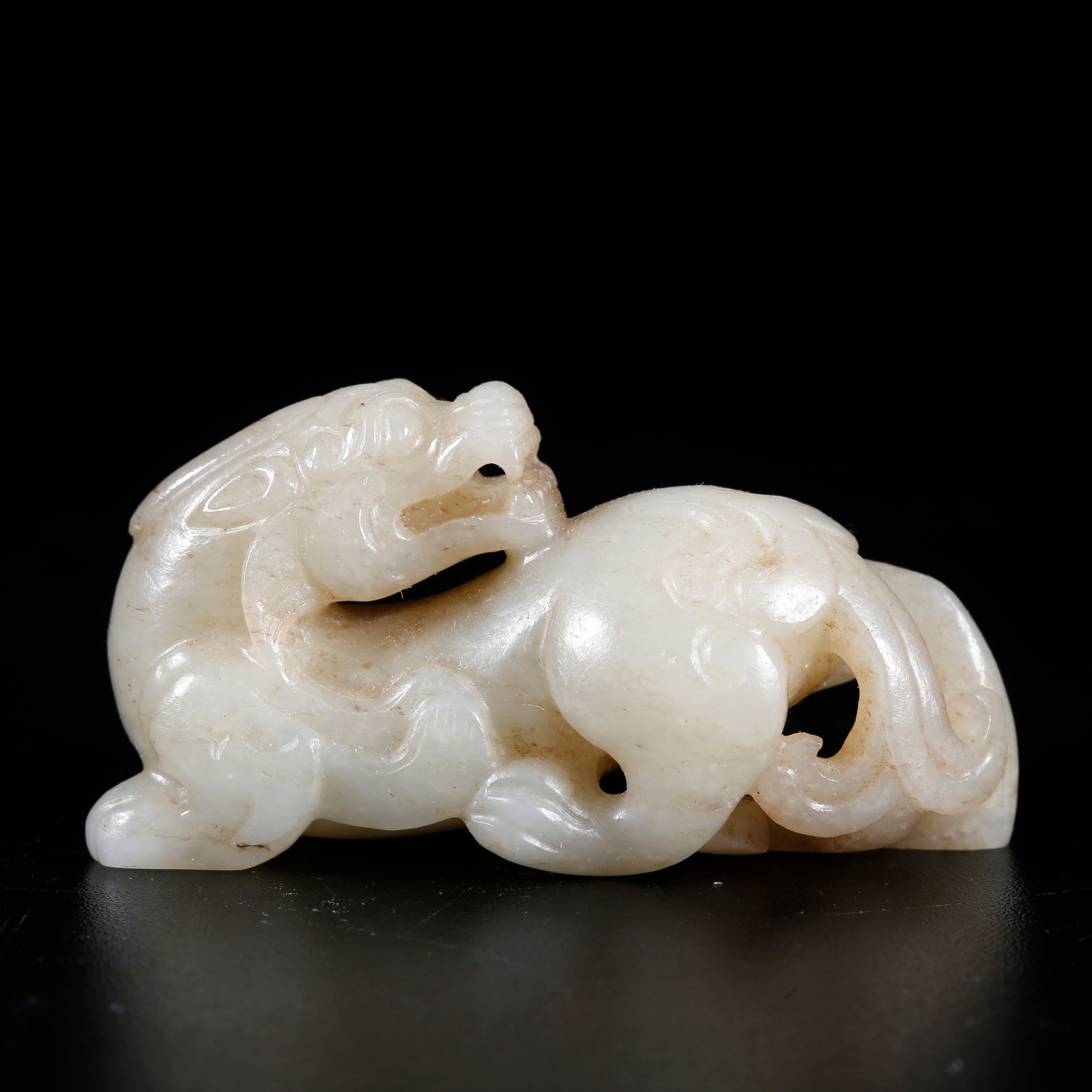 A HETIAN JADE BEAST-SHAPED ORNAMENT: Hetian Jade Beast-shaped Ornament
