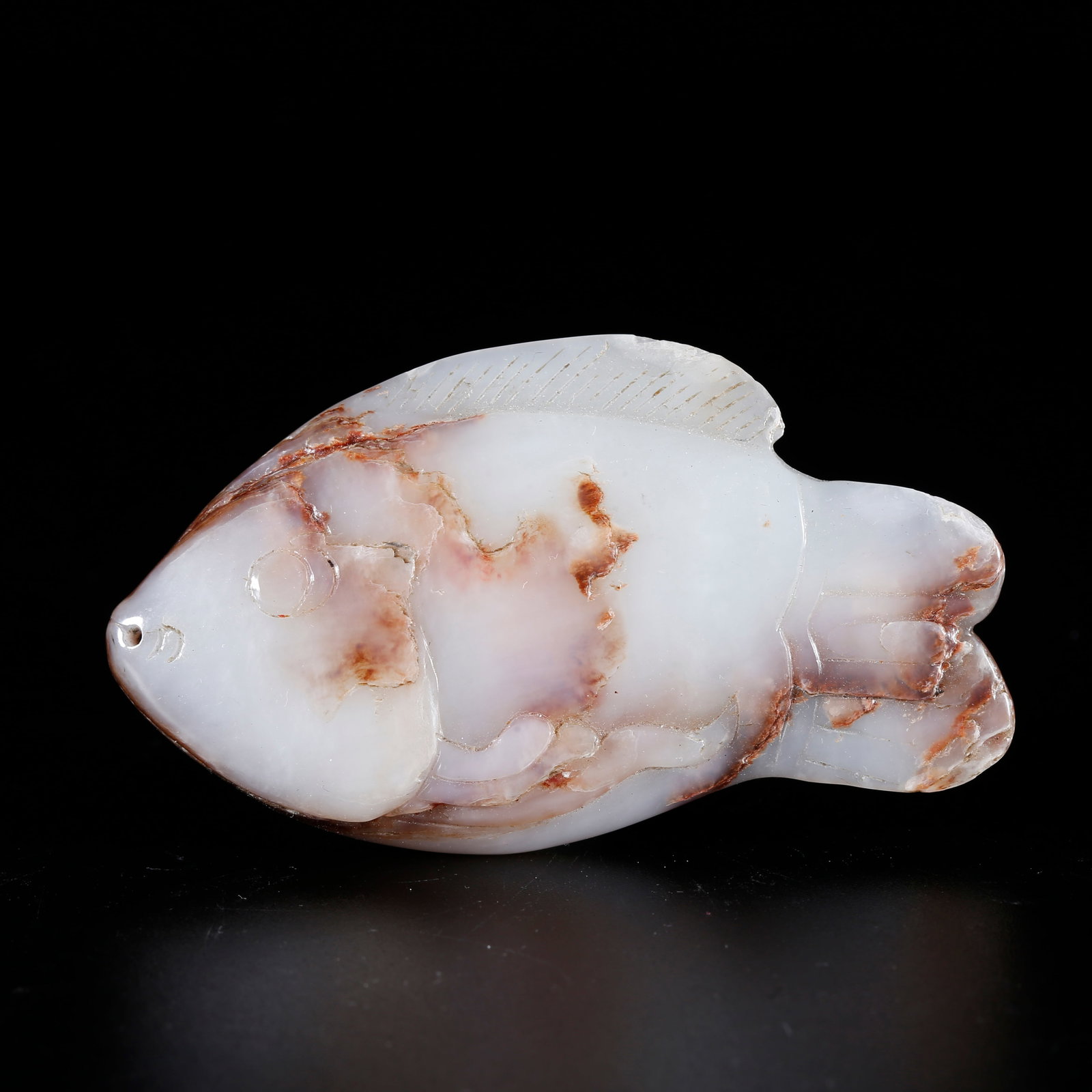 A HETIAN JADE CARVED FISH FIGURINE: Hetian jade carved fish figurine