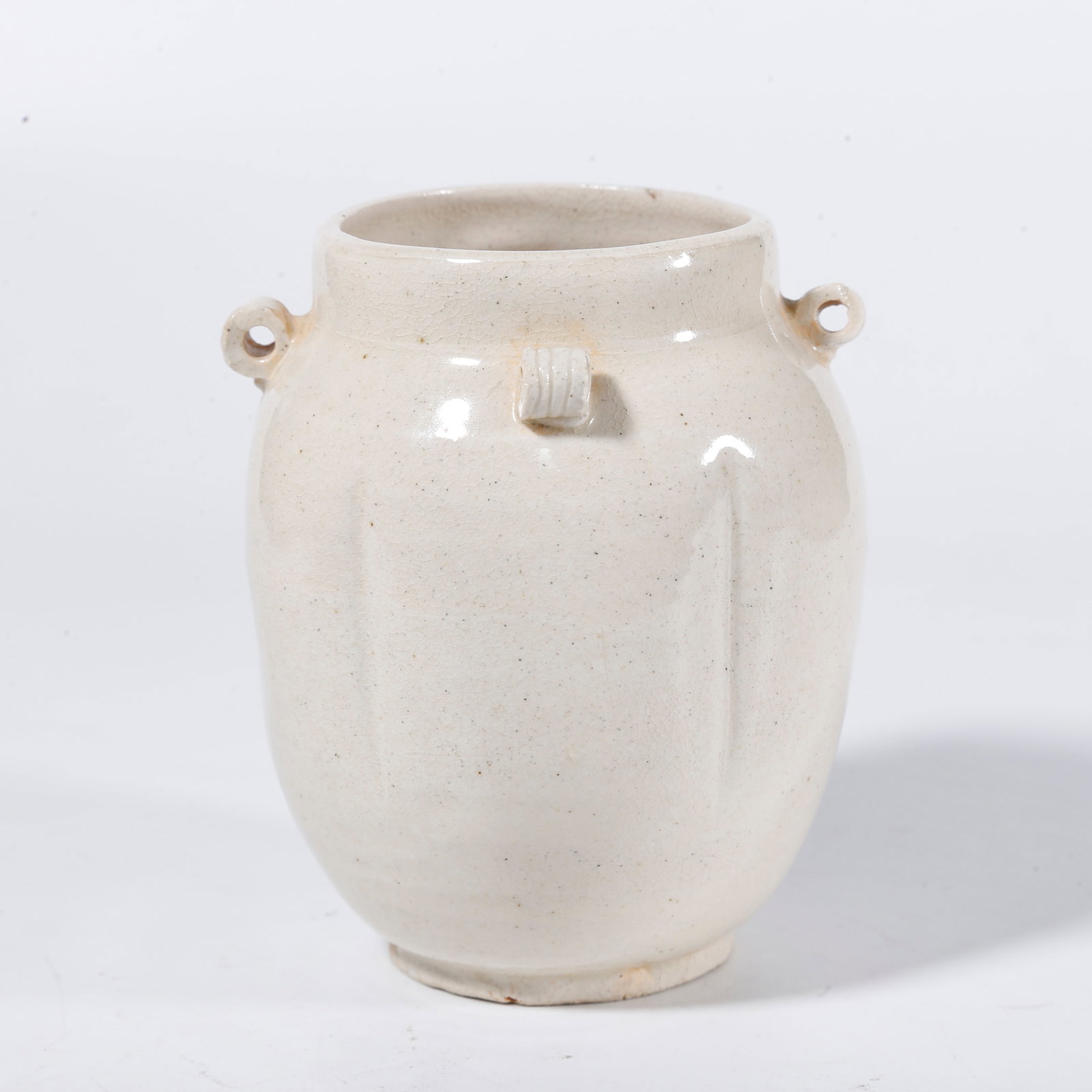 A OLD KILN FOUR-LUG LOBED JAR: Old kiln four-lug lobed jar
