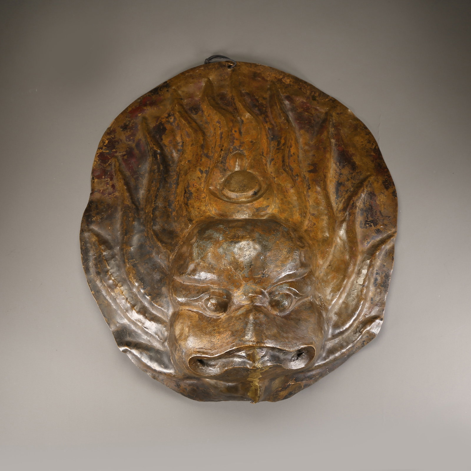 A HAMMERED BRONZE GARUDA PENDANT: Hammered bronze Garuda pendant