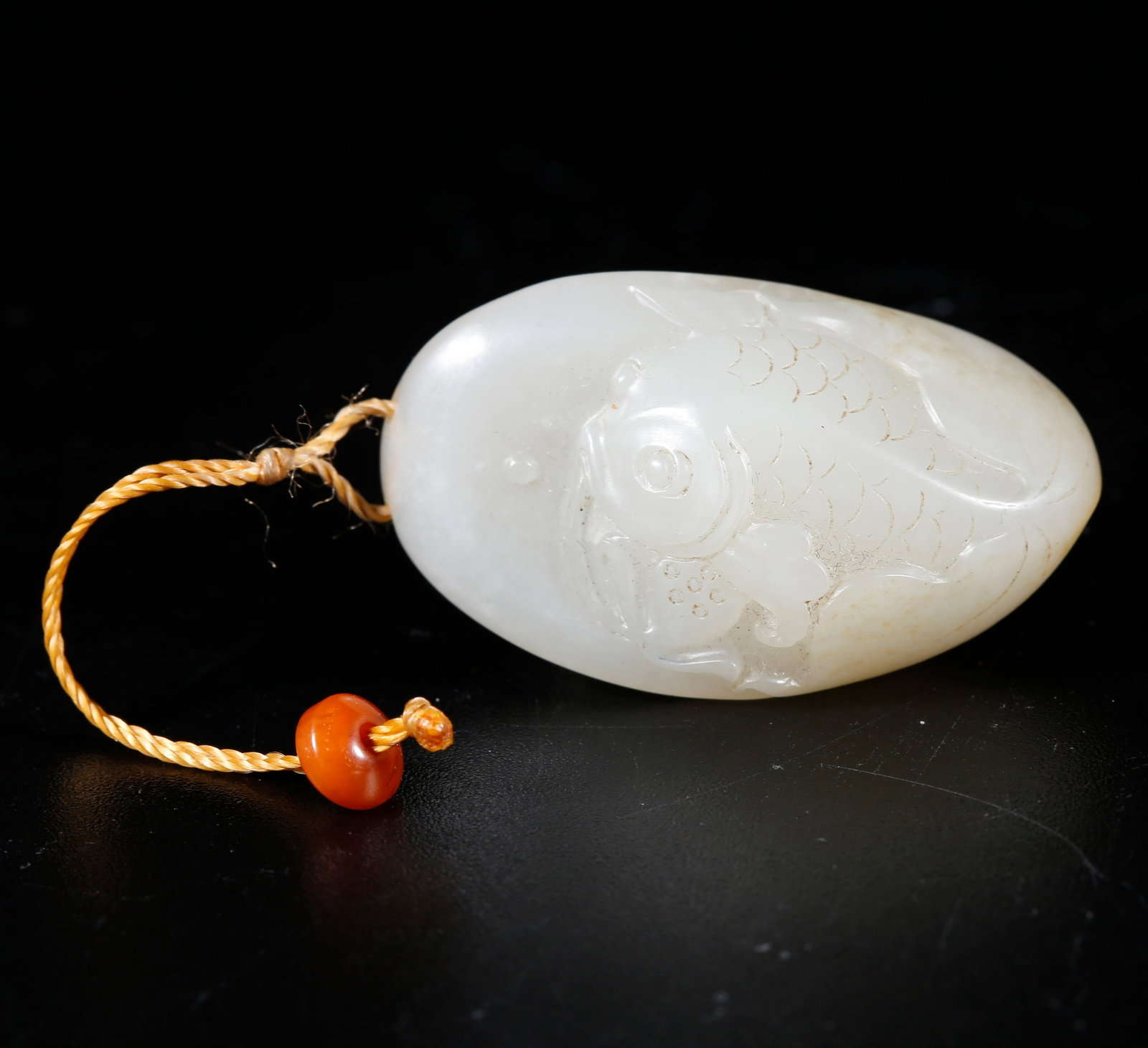 A HETIAN JADE CARVED FISH FIGURINE: Hetian jade carved fish figurine