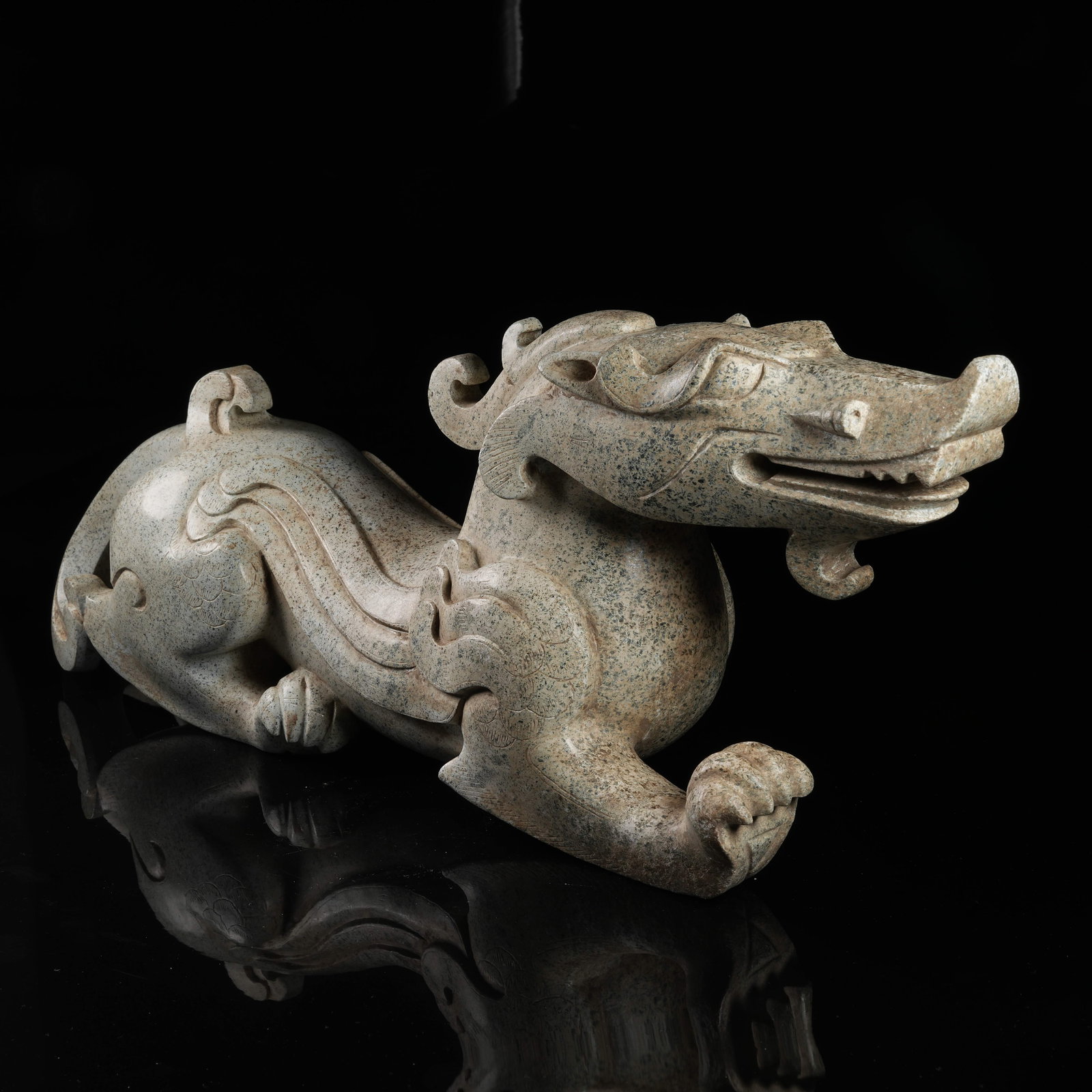 A ARCHAIC JADE AUSPICIOUS BEAST FIGURINE (1 of 8)