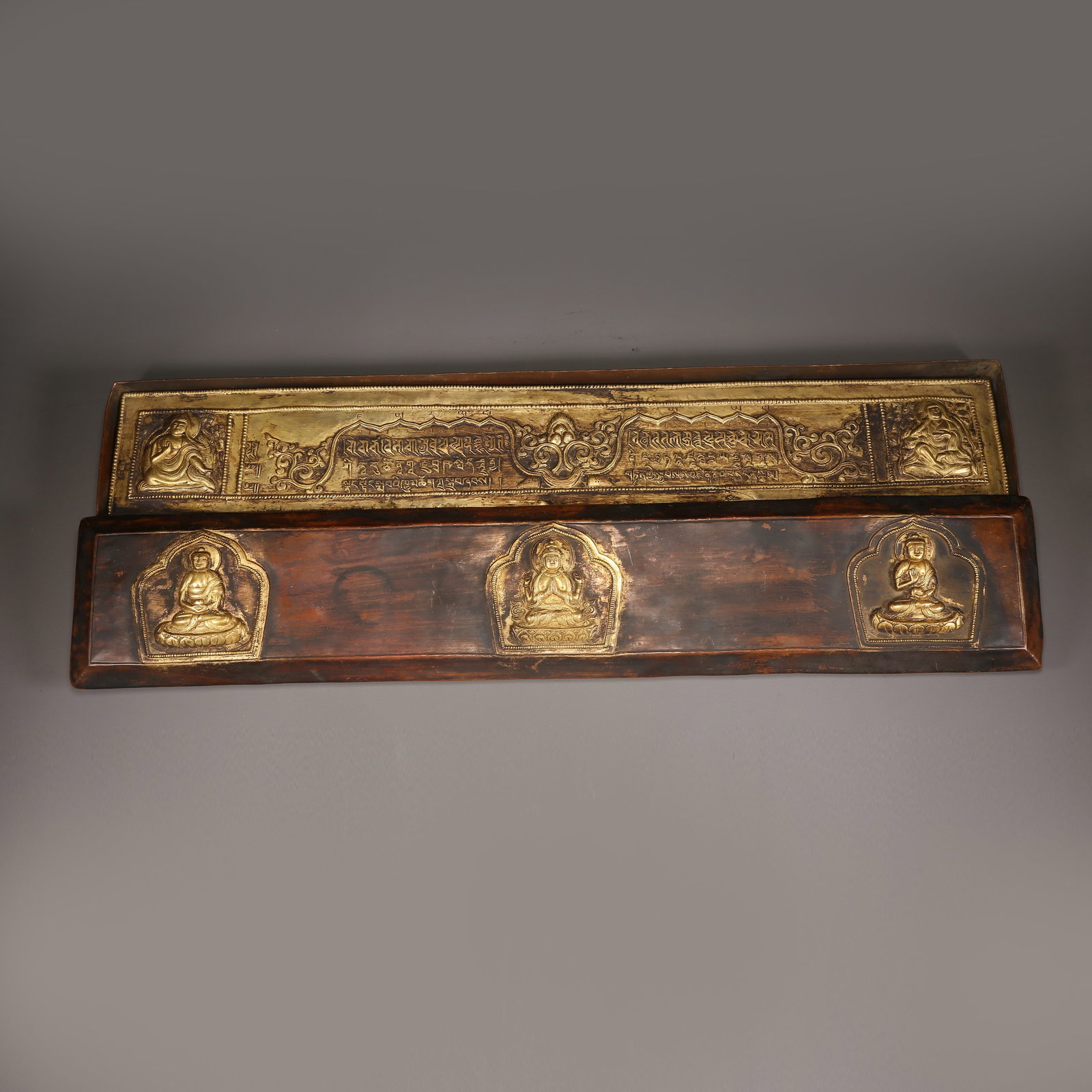 A GILT BRONZE SUTRA IN A CASE (1 of 12)