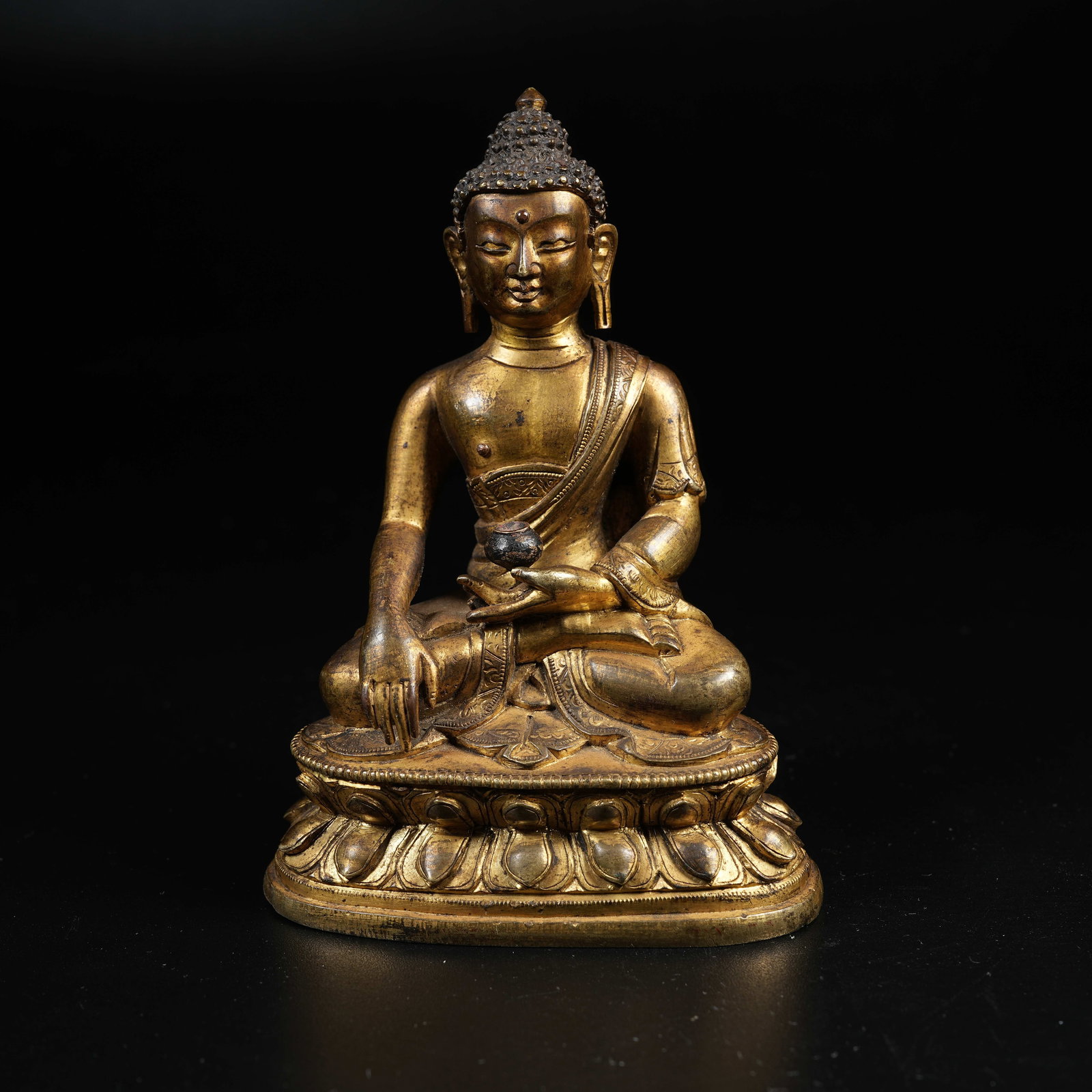 A GILT BRONZE STATUE OF MEDICINE BUDDHA (1 of 9)