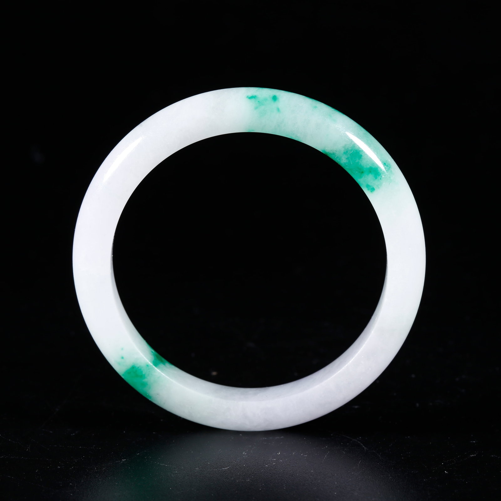 A JADEITE CARVED BRACELET (1 of 9)