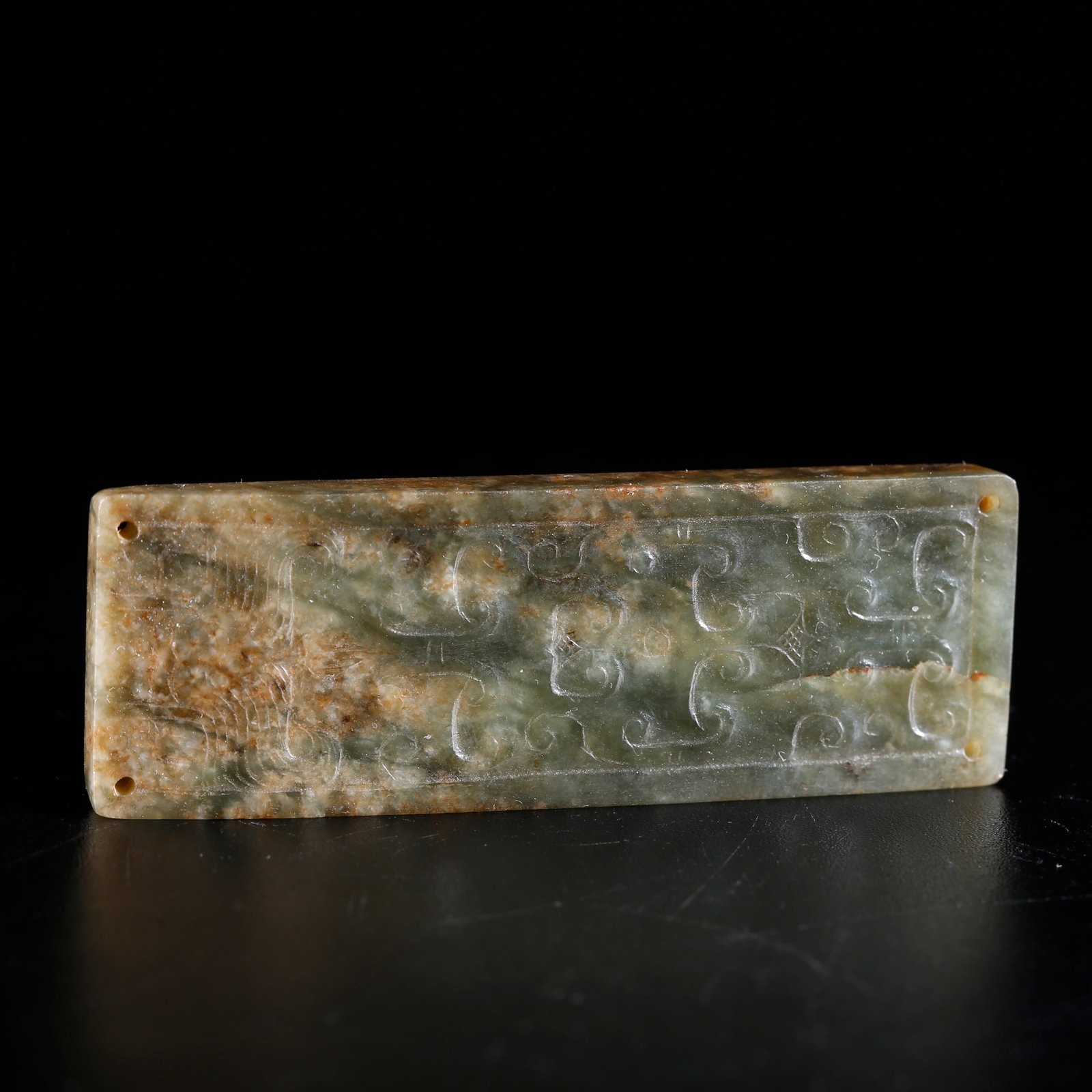 A HETIAN JADE BELT PLAQUE CARVED WITH AUSPICIOUS CLOUD PATTERN: Hetian Jade Belt Plaque Carved with Auspicious Cloud Pattern