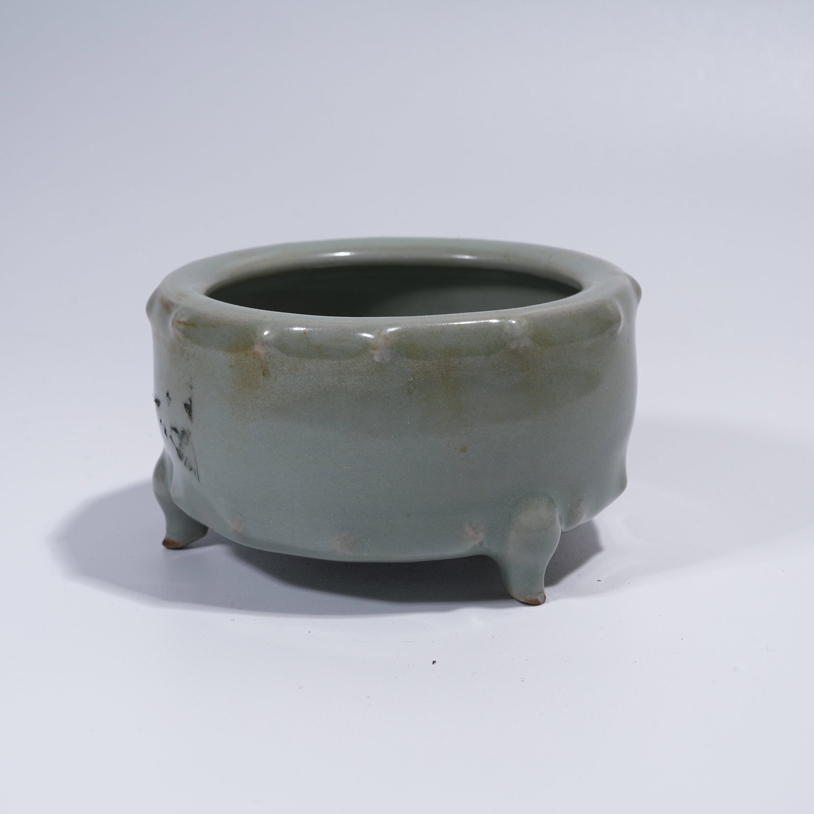 A LONGQUAN KILN THREE-LEGGED DRUM-SHAPED CENSER (1 of 9)