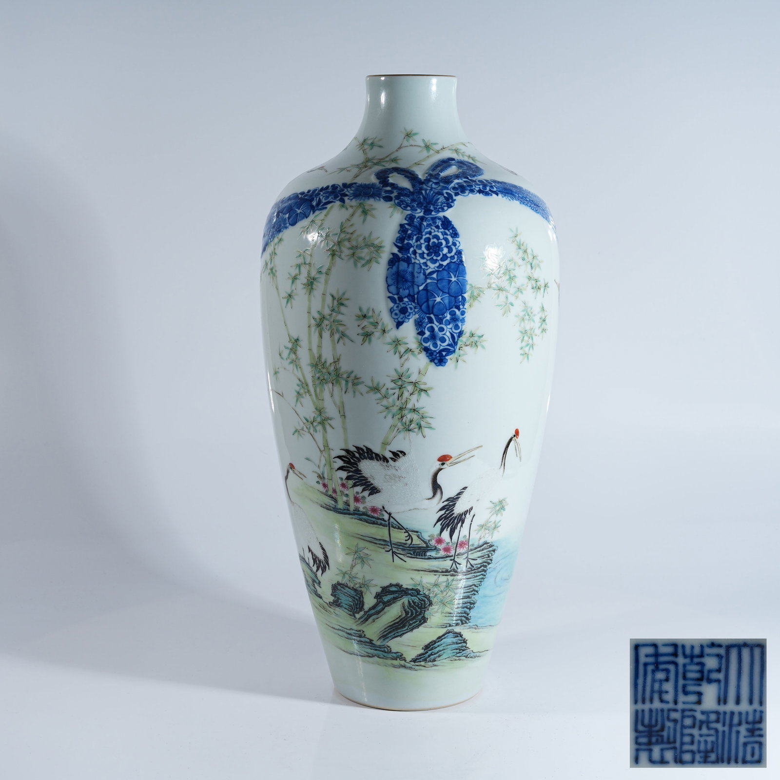 A BLUE AND WHITE FAMILLE ROSE VASE WITH WRAPPER AND CRANE PATTERNS: Blue and White Famille Rose Vase with Wrapper and Crane Patterns