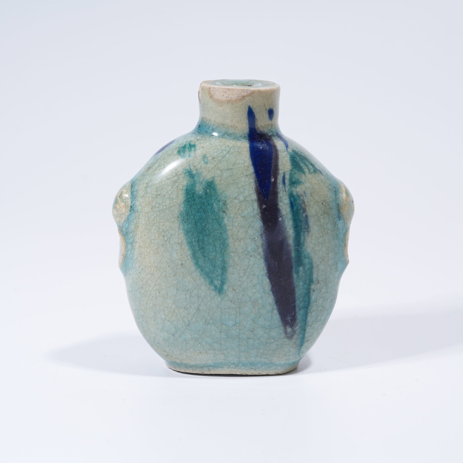 A FLAMED GLAZE BEAST HEAD SNUFF BOTTLE: Flamed Glaze Beast Head Snuff Bottle