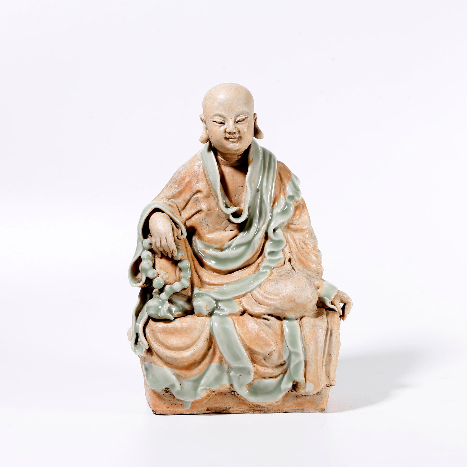 A BUDDHA STATUE FROM LONGQUAN KILN: Buddha Statue from Longquan Kiln