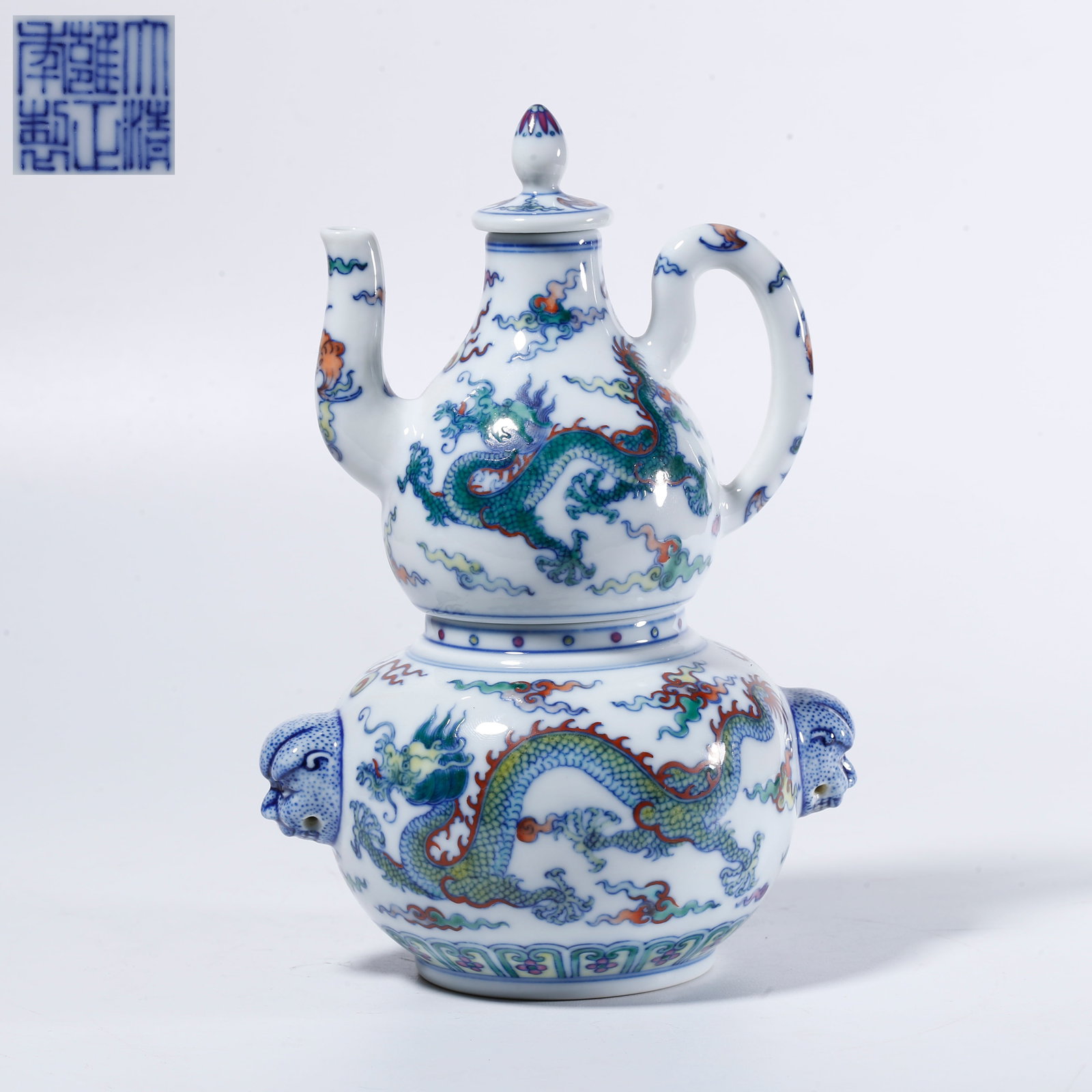 A FAMILLE-ROSE CLOUD-AND-DRAGON PATTERN EWER: Famille-rose cloud-and-dragon pattern ewer